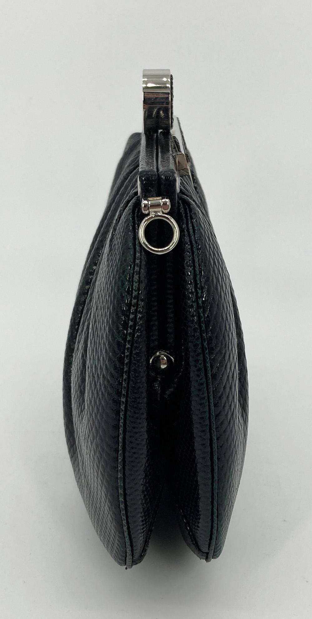 Vintage Judith Leiber Black Lizard Crystal Top Clutch in very good condition. Black lizard exterior trimmed with silver hardware and black and clear crystal top accents. Lift latch closure opens to a black satin interior with one slit and one zip