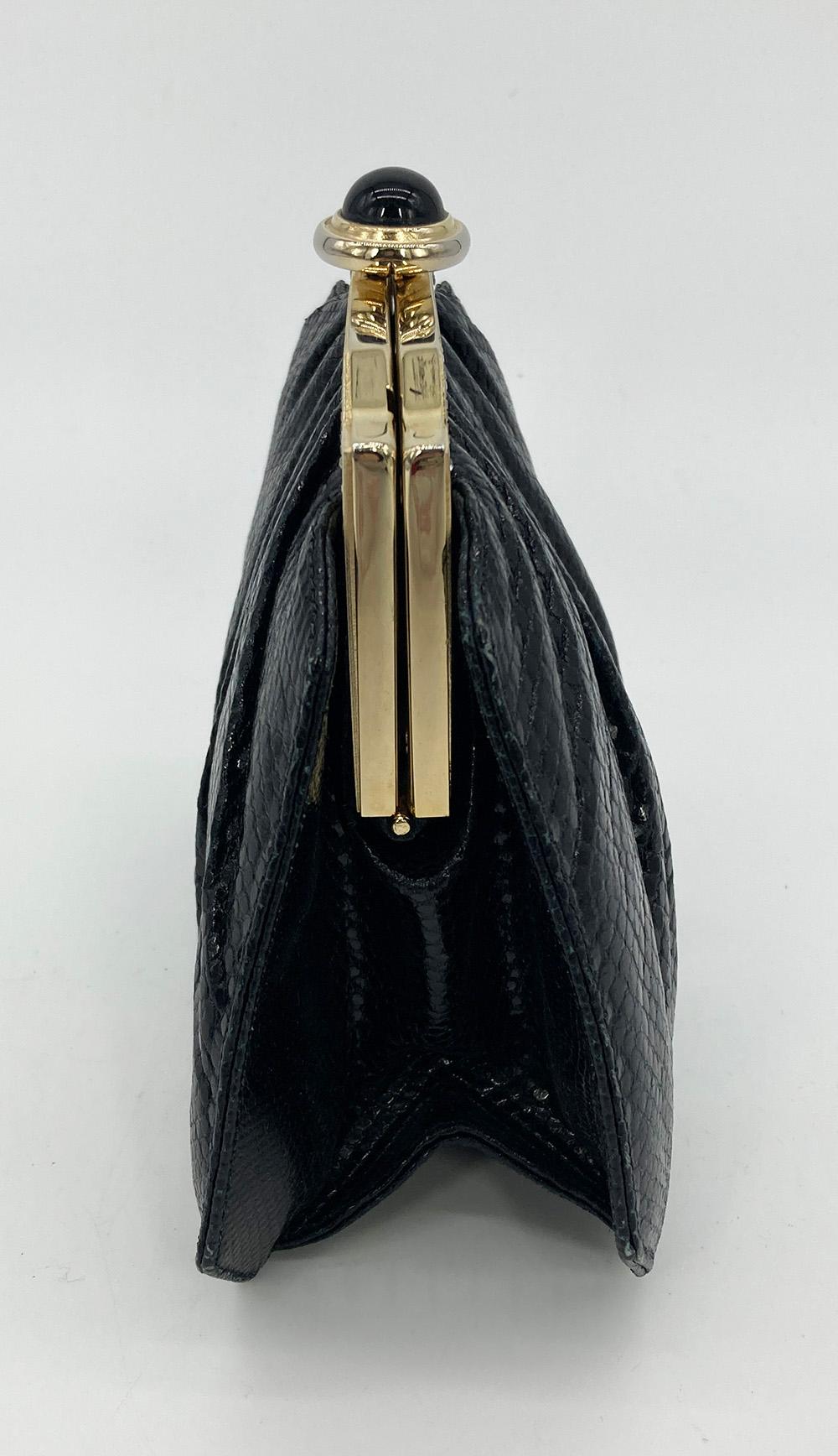 Judith Leiber Black Lizard Enamel Top Clutch in good vintage condition. Black lizard leather exterior trimmed with swarovski crystals, gold hardware and black and yellow enamel top edge. Top lift button closure opens to a black satin lined interior