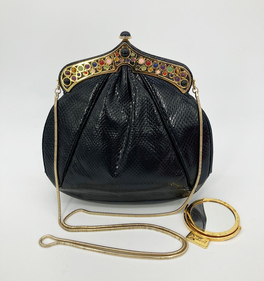 Vintage Judith Leiber Black Lizard Gemstone Shoulder Bag in excellent condition. Black lizard trimmed with gold hardware and multi colored gemstones along top edge. Unique middle eastern style and shape. Top button closure opens to a black nylon