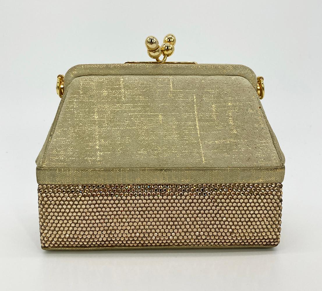 Vintage Judith Leiber Gold Suede and Swarovski Minaudiere in excellent condition. Unique double compartment design. Top compartment has a beige and gold suede body with top kiss lock closure. Bottom compartment surrounded in gold swarovski crystals