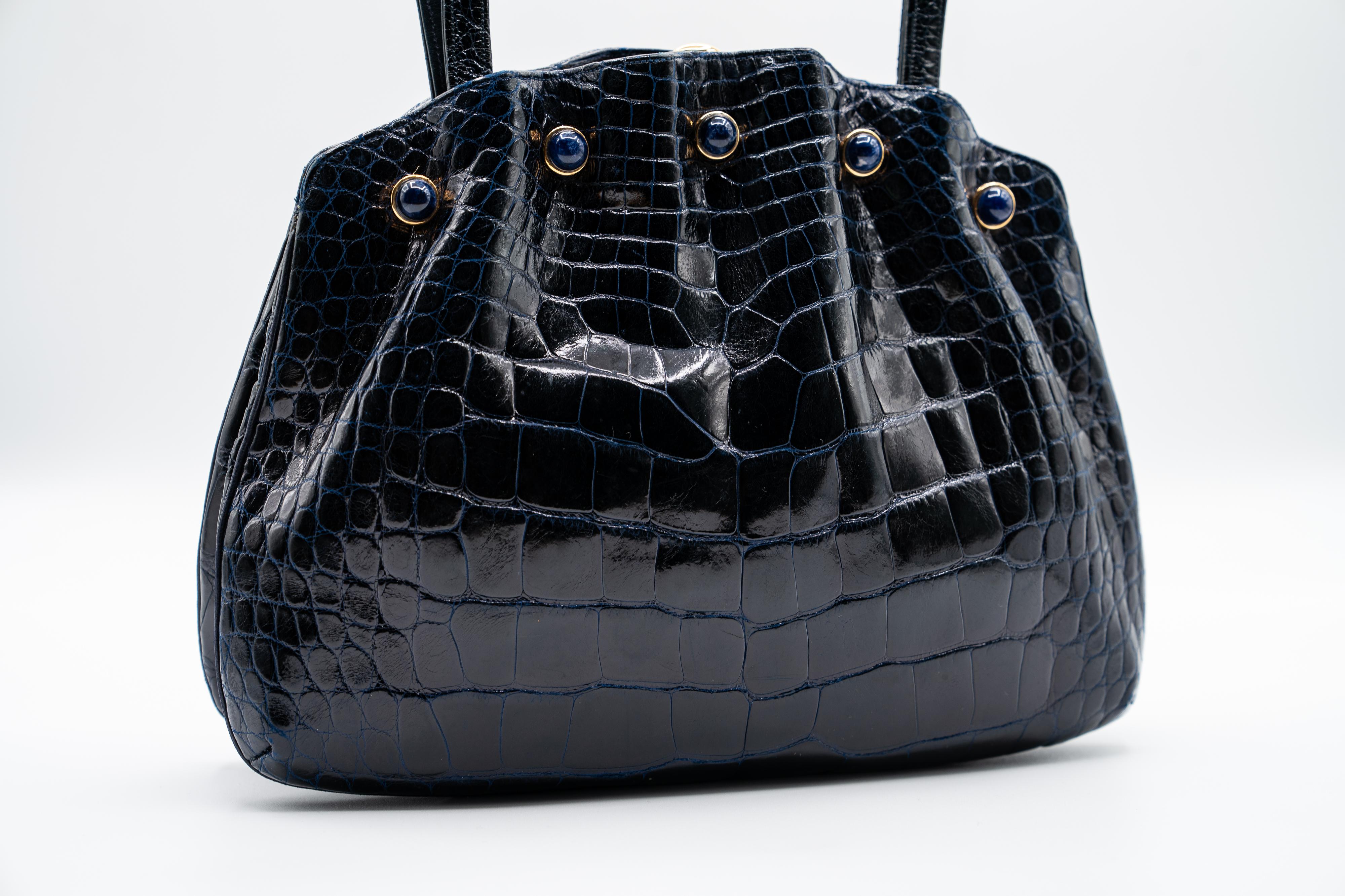 Judith Leiber was a renowned Hungarian-American designer known for her luxurious and artistic handbags. Founded in 1963, her brand became synonymous with elegance and craftsmanship, often featuring intricate designs and opulent materials like exotic