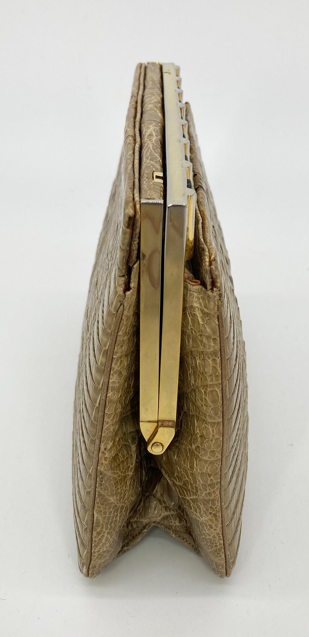 Judith Leiber Natural Tan Hornback Alligator Clutch in good condition. Natural light tan hornback alligator exterior trimmed with silver and gold hardware. Top side pull lever closure opens to a tan satin interior with one slit and one zipped side