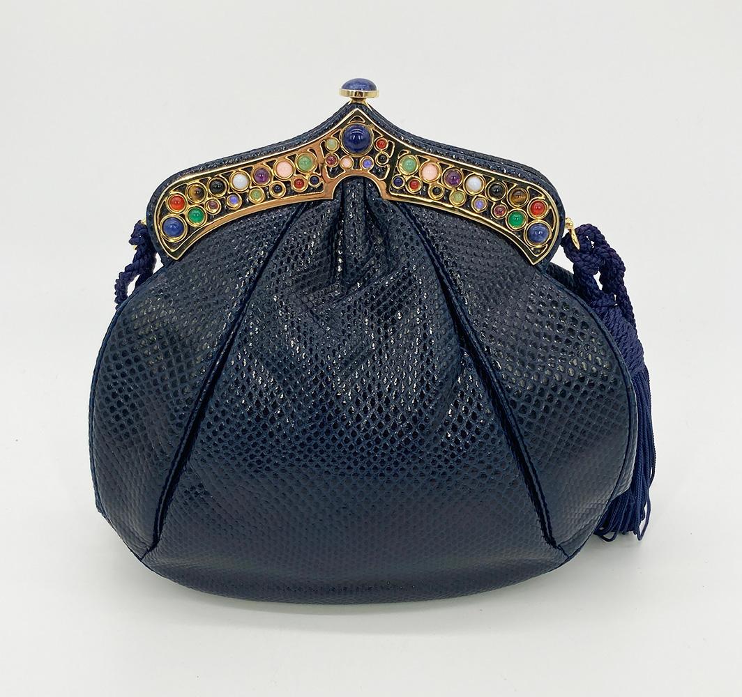 Vintage Judith Leiber Navy Lizard Gemstone Top Shoulder Bag in excellent condition. Navy lizard trimmed with gold hardware, multi colored gemstones along top edge, and navy blue corded shoulder strap with tassel detail. Unique middle eastern style
