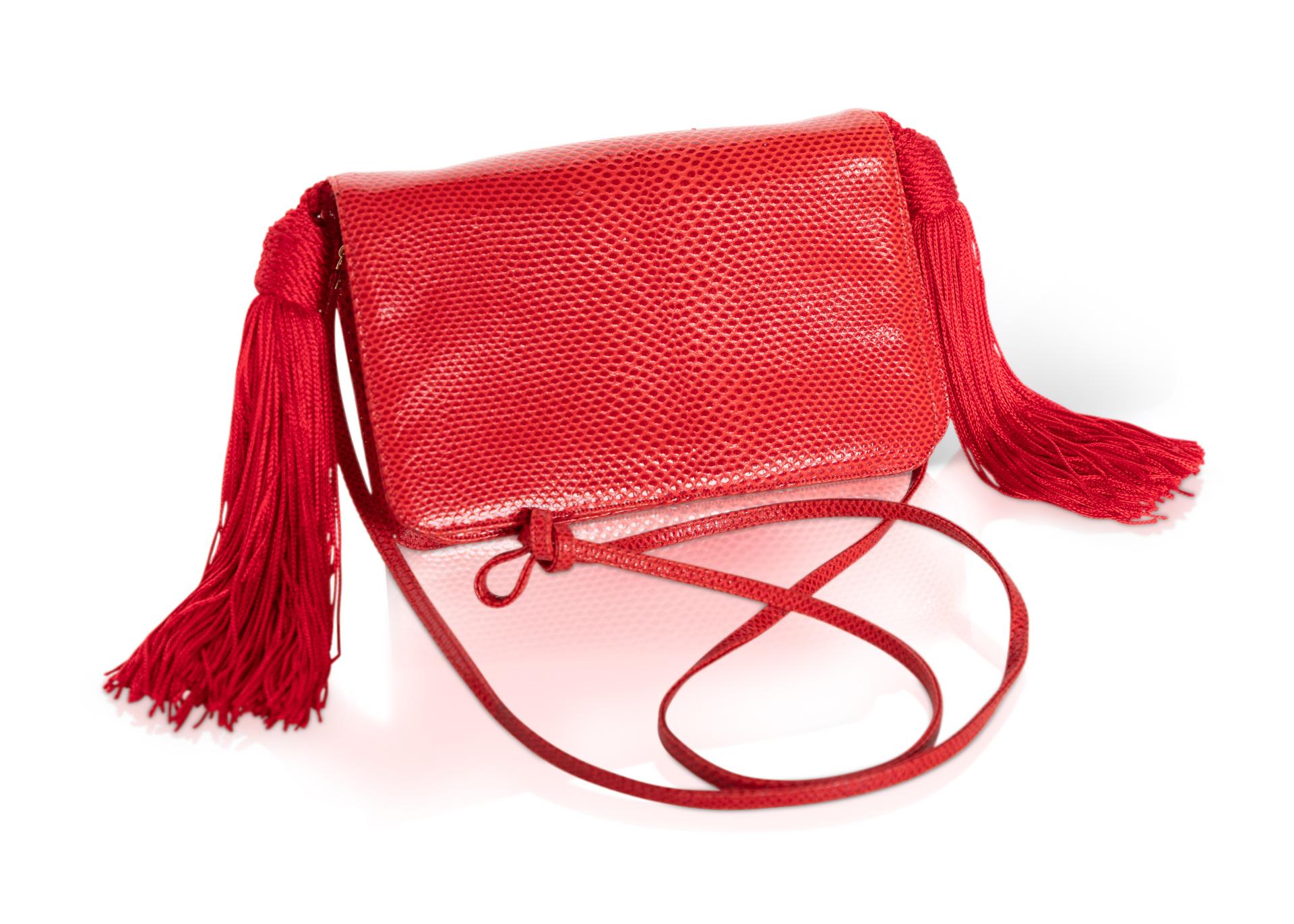 While Judith Leiber designs typically are known for their eccentricity, all Judith Leiber designs have a unique character that comes through in their composition. Done in a candy apple red karung snakeskin, this vintage bag offers a sexy and stylish