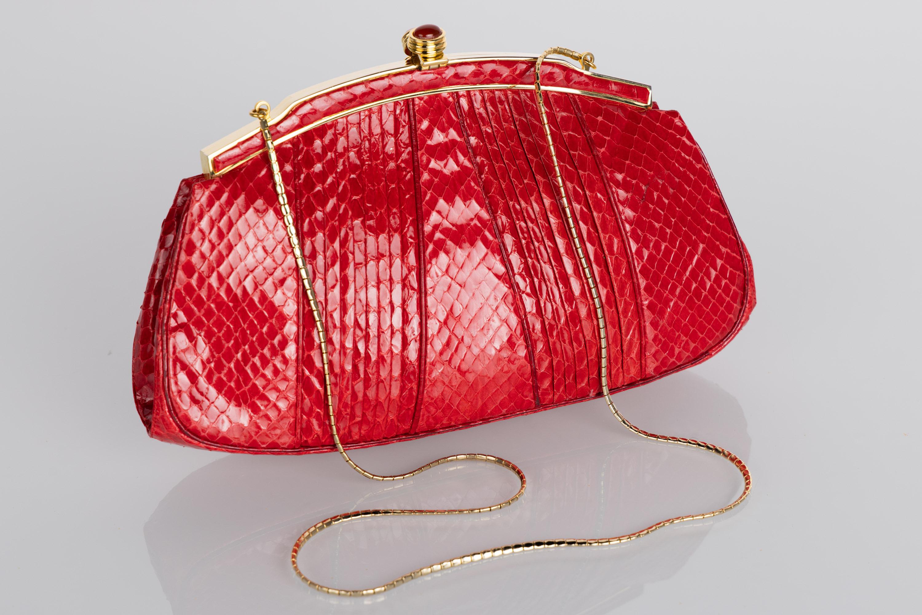 red snake skin purse
