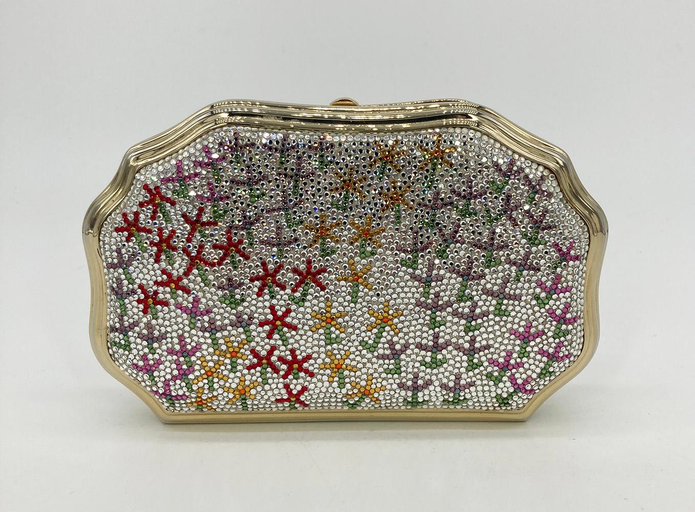 Vintage Judith Leiber Floral Print Minaudiere in very good condition. Clear swarovski crystals with red, pink, purple and orange stick figure flowers along both front and back sides. Top button closure opens to a gold leather interior with hidden