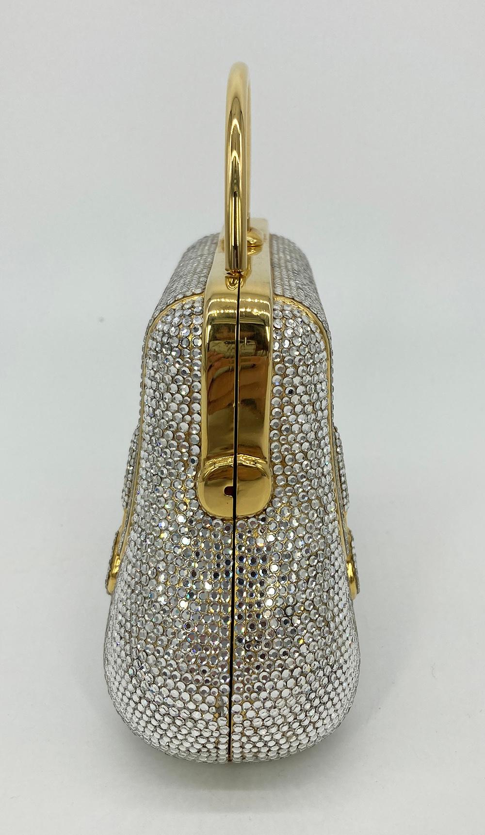 Vintage Judith Leiber Top Handle Swarovski Crystal Minaudiere in excellent condition. Unique mini briefcase design with solid metal curved top handle, clear swarovski crystals throughout and gold body. Top closure opens to a gold leather interior