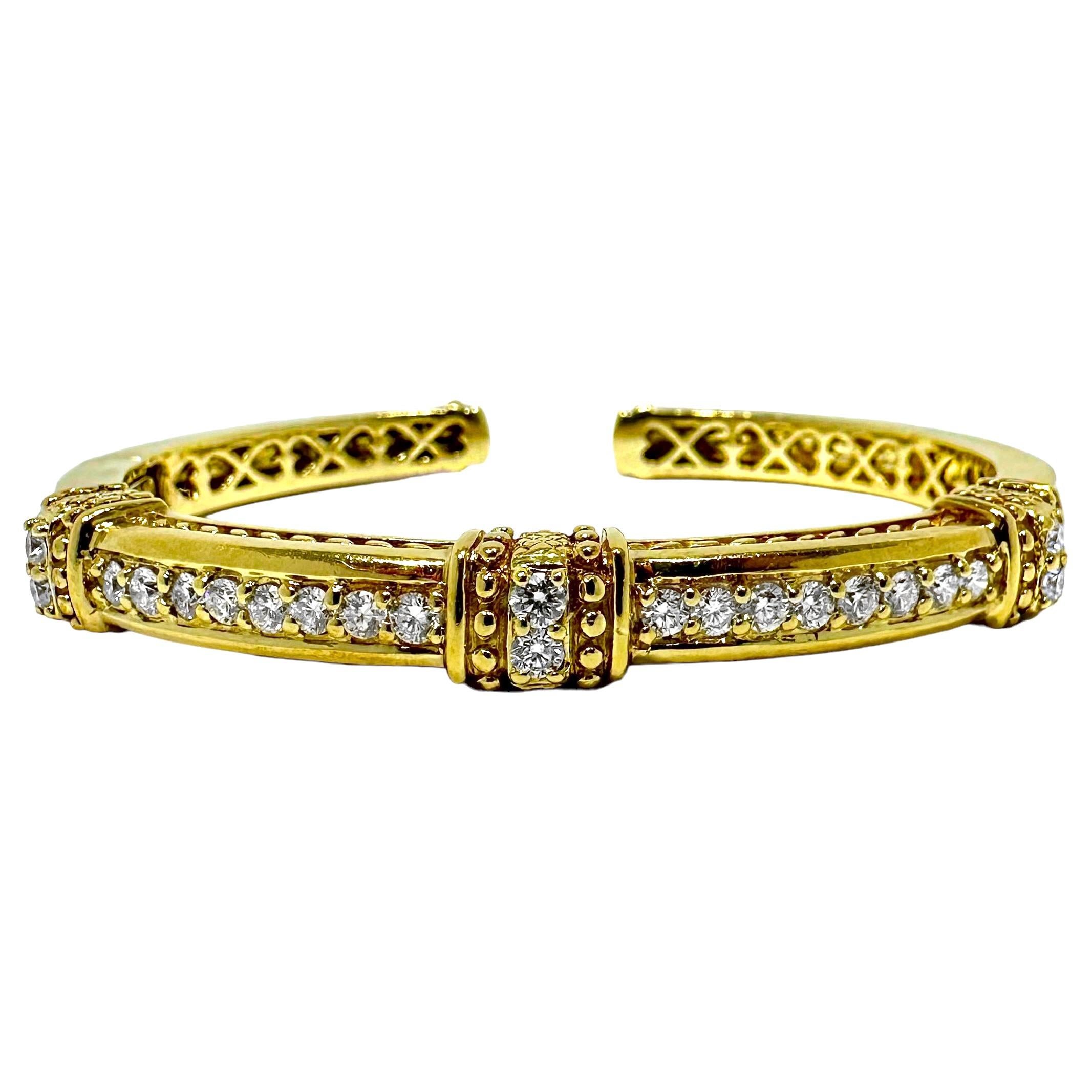 This tasteful, vintage, 18k yellow gold bangle bracelet by designer Judith Ripka, puts on display the best of this highly regarded designer's style and craftsmanship. Great for wearing alone, or for stacking with other bracelets. It is satin finish
