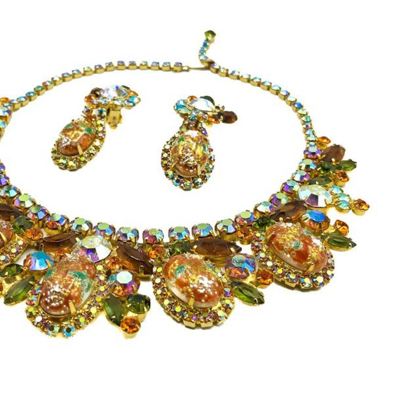 A stunning DeLizza & Elster, Vintage Juliana Easter Egg necklace and earrings demi parure dating to the 1950s. The 'Easter Egg' glass cabochon stones are exquisite, teamed with green tourmaline and topaz pear shape crystals alongside fiery orange