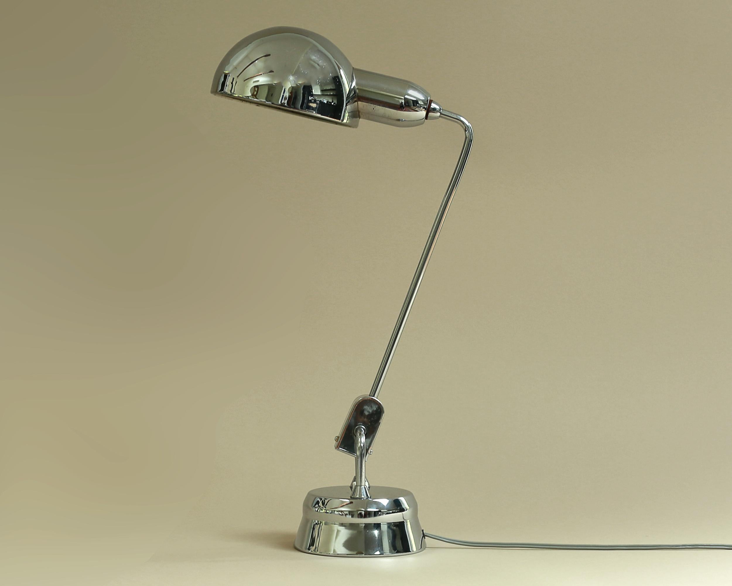 The JUMO model 600 desk lamp was designed in 1940 by André Mounique and Yves Jujeau for their lighting company, JUMO, which was located outside of Paris.  The light won world notoriety when renowned architect/designer, Charlotte Perriand, chose this