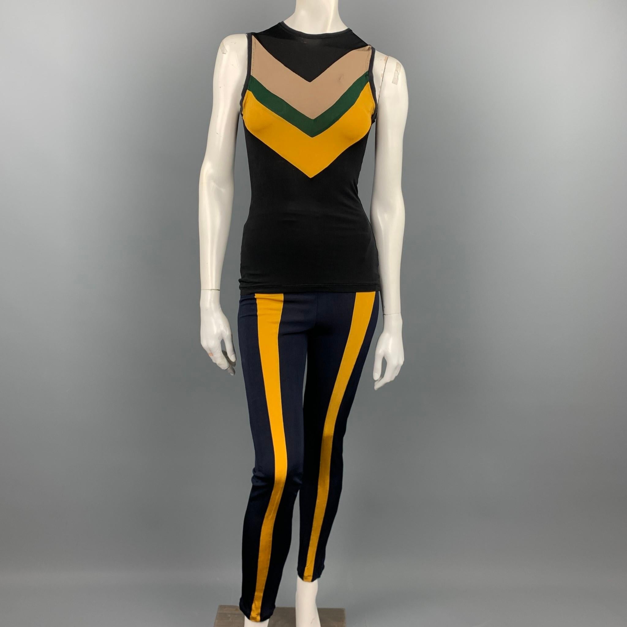Vintage JUNIOR GAULTIER tank top set comes in a black & multi-color viscose blend with a color block design featuring a sleeveless style, crew-neck, and includes navy color block high waisted leggings. Minor wear. Made in Italy.

Good Pre-Owned