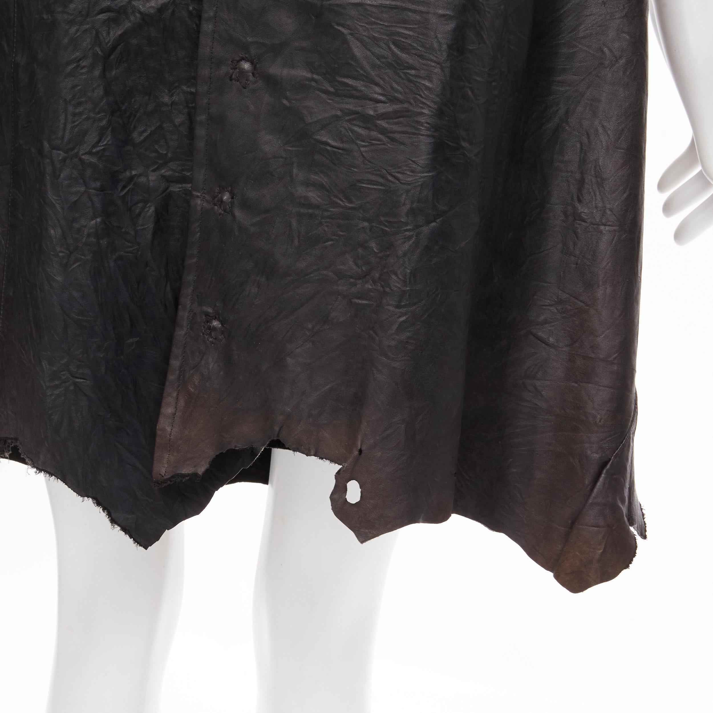 vintage JUNYA WATANABE 1992 black cow hide leather distressed raw cut button front dress M 
Reference: CRTI/A00405 
Brand: Junya Watanabe 
Collection: 1992 
Material: Leather 
Color: Black 
Pattern: Solid 
Closure: Snap 
Extra Detail: Scoop neck.