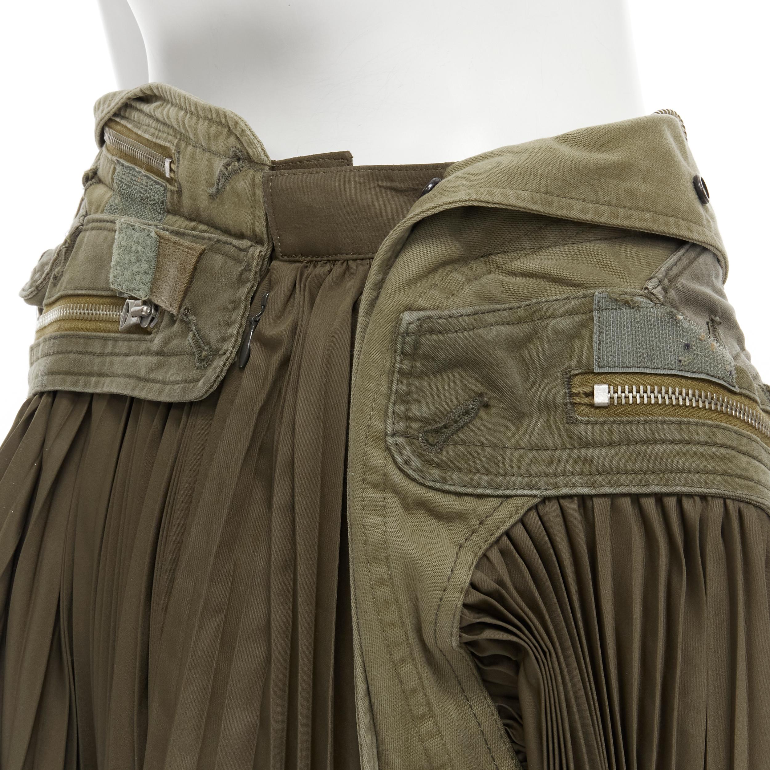 vintage JUNYA WATANABE 2006 military green deconstructed zipper pleated skirt S Reference: CRTI/A00305 
Brand: Junya Watanabe
Designer: Junya Watanabe 
Collection: 2006 
Material: Polyester 
Color: Green 
Pattern: Solid 
Closure: Zip 
Made in: Japan