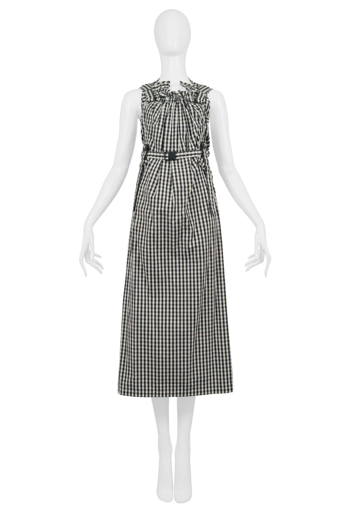 Resurrection Vintage is excited to offer a vintage Junya Watanabe for Comme des Garcons sleeveless black and white gingham check parachute dress featuring a gathered neckline with a keyhole opening in the back, multiple straps, utility buckles and