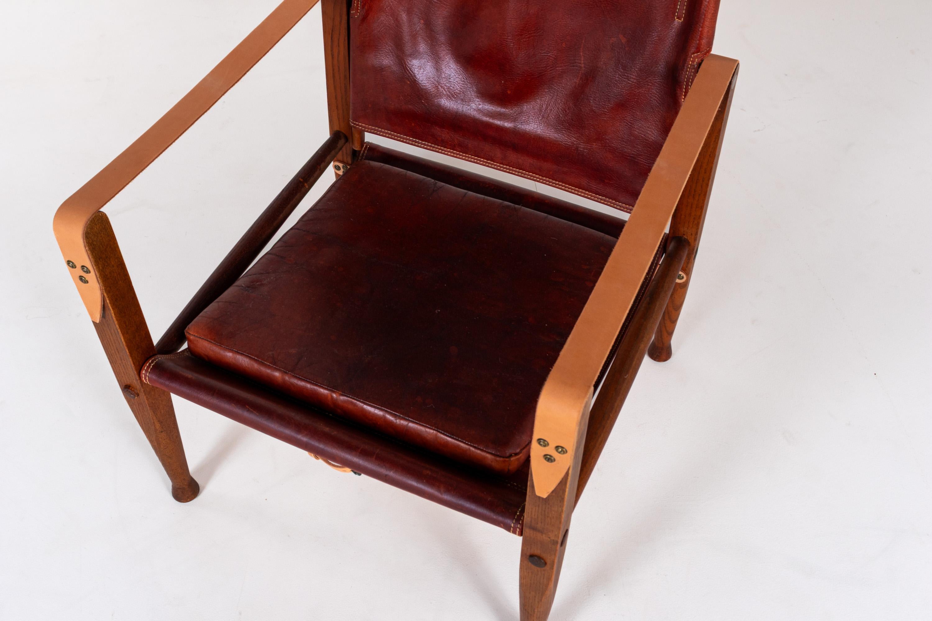 The KK47000 Safari Chair was designed by Kaare Klint in 1933 and produced by Rud Rasmussen, Denmark. Recognized as one of the first examples of functionalist flat-pack furniture, it set a precedent for modern design with its elegant simplicity and