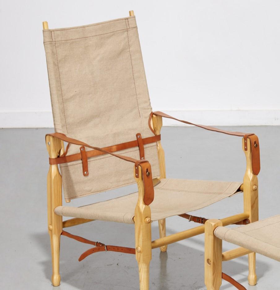 A.I.C., sedia e pouf da campagna in stile safari in legno, tela e pelle, senza marchio. Un set di sedie e pouf pratico, organico, confortevole, elegante e pratico; una descrizione che racchiude i mobili in stile Campaigner.

Circa:
La storia della
