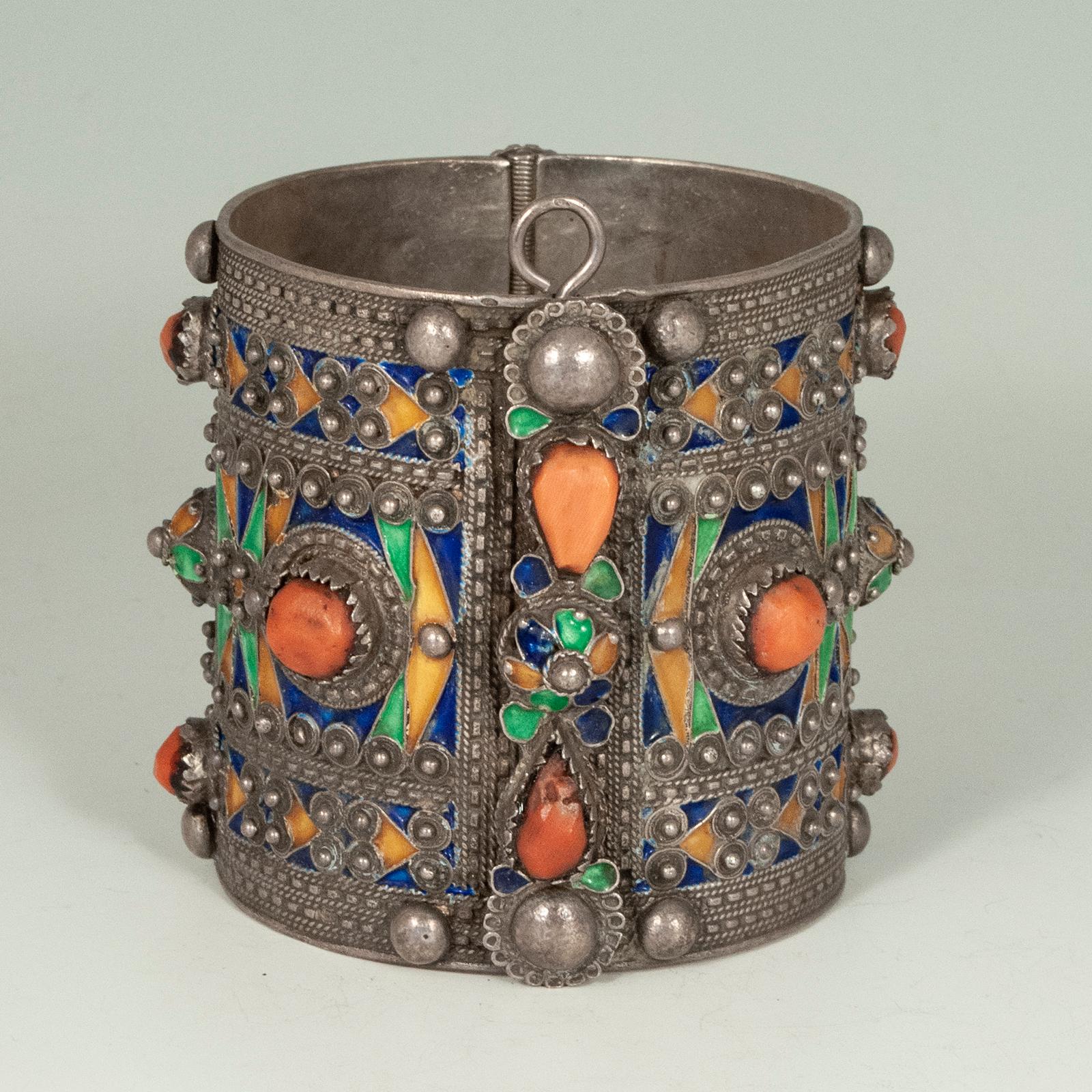 Kabylie Berber Enamel and Silver Cuff, Northern Algeria

A nice vintage green, blue and yellow enamel and silver bracelet from the Kabylie Berber people of Northern Algeria. It opens and closes securely and easily with the pin. The orange cabochons