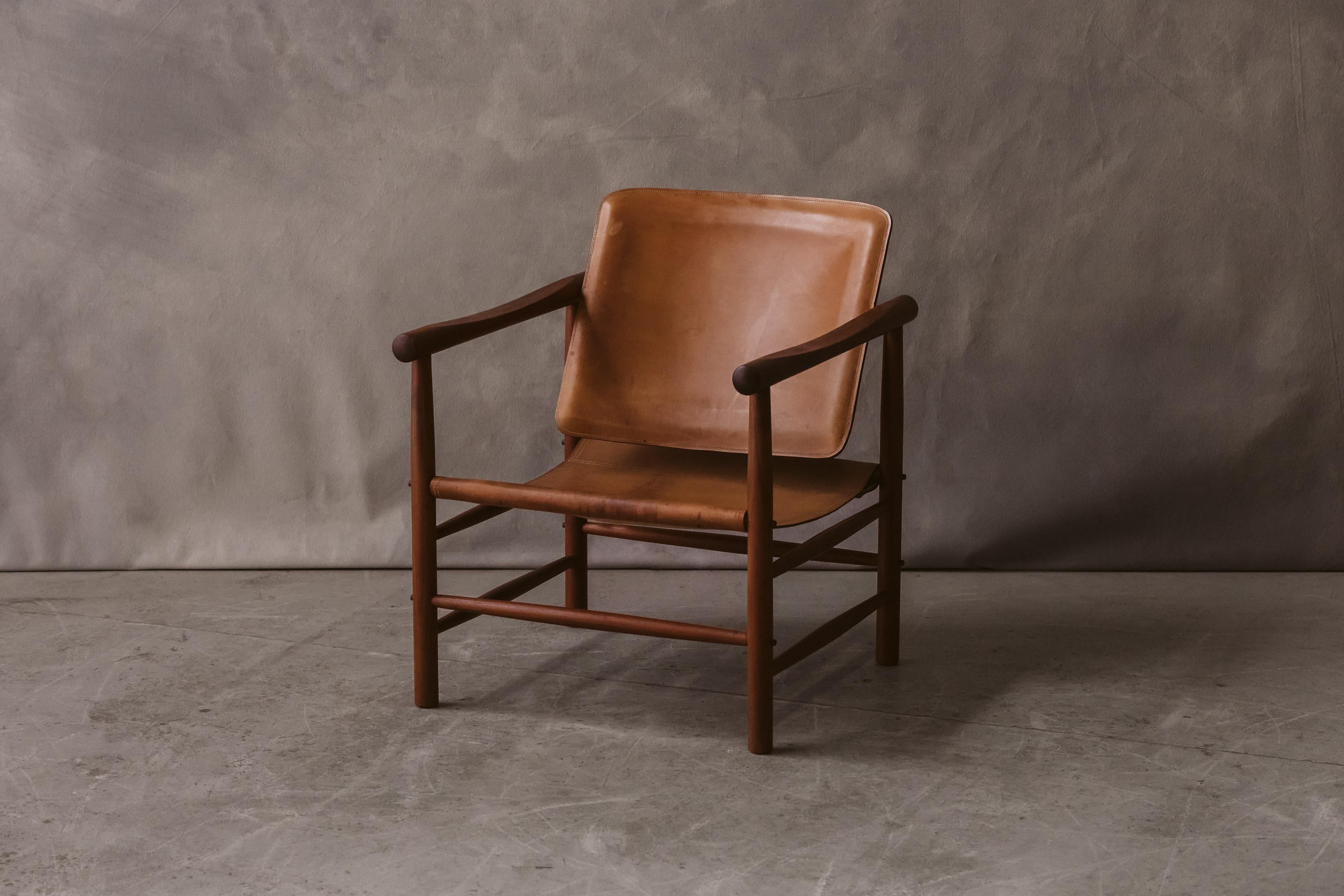 Vintage Kai Lyngfeldt Larsen Lounge chair from Denmark, Circa 1970. Solid oak and original cognac leather construction. 

We don't have the time to write an extensive description on each of our pieces. We prefer to speak directly with our clients. 