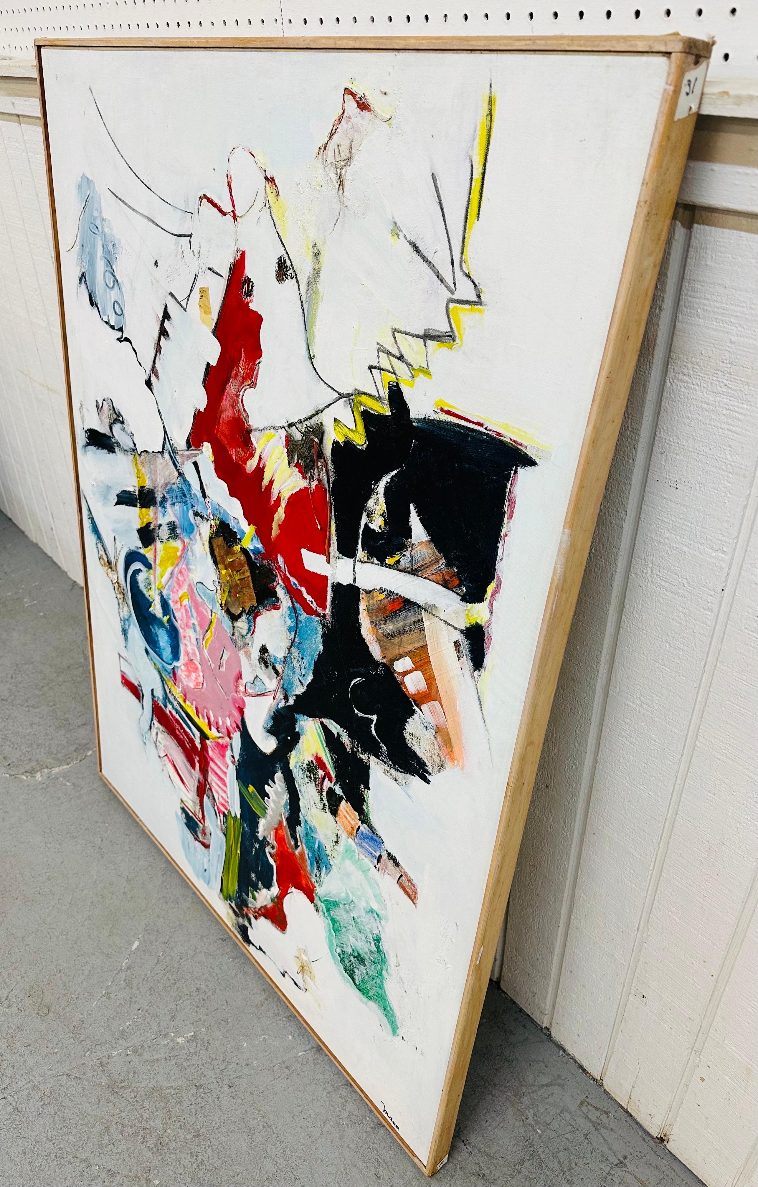 This listing is for a vintage Kandinsky Style Abstract Painting Signed E. Miller. Featuring a wooden frame, white background with an array of colors over top, and a wire on the back for hanging. This is an exceptional piece of art done by artist