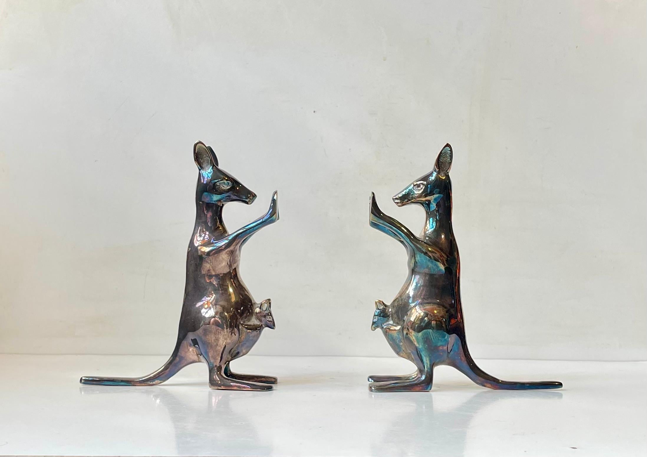 Decorative pair of rare mother kangaroo bookends with Joey's/babies. Made from silver plated brass. They have developed a unique rainbow-like patina over the years but obviously can be polished to a more classic silver shine. Unknown European maker