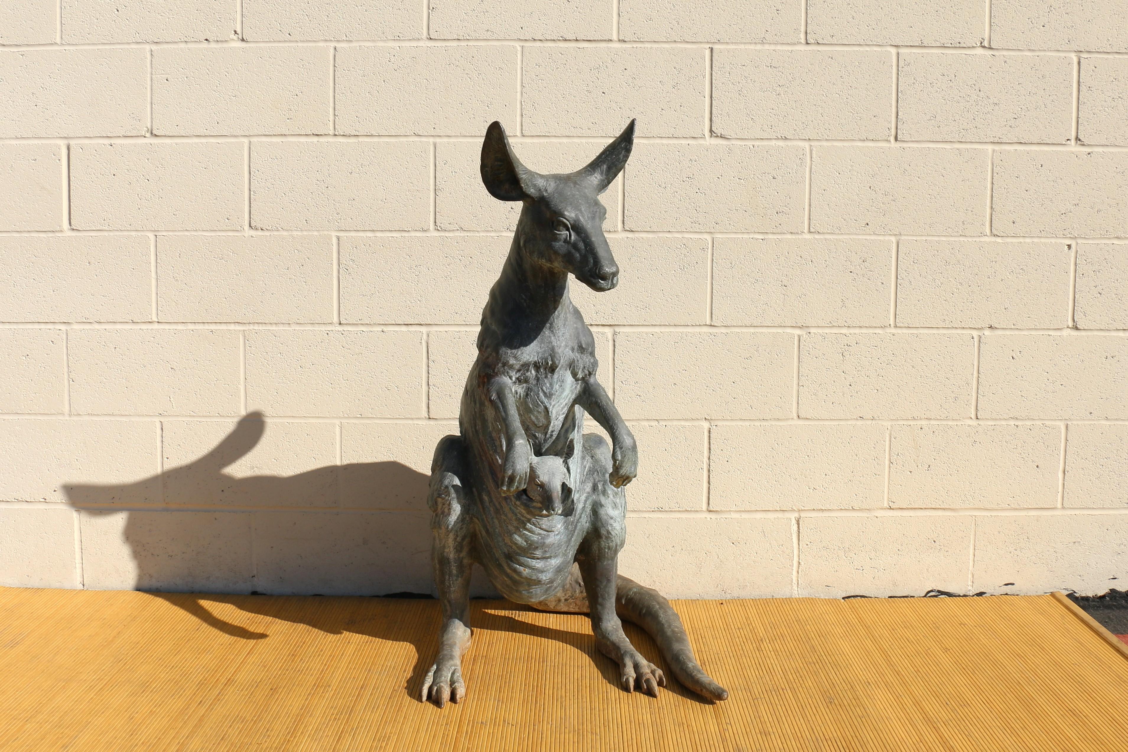The sculpture is a kangaroo figurine signed by J. Daste. It depicts a kangaroo with a joey in its pouch. This wonderful statue is made of bronze. Absolutely nice work and it has original patina.