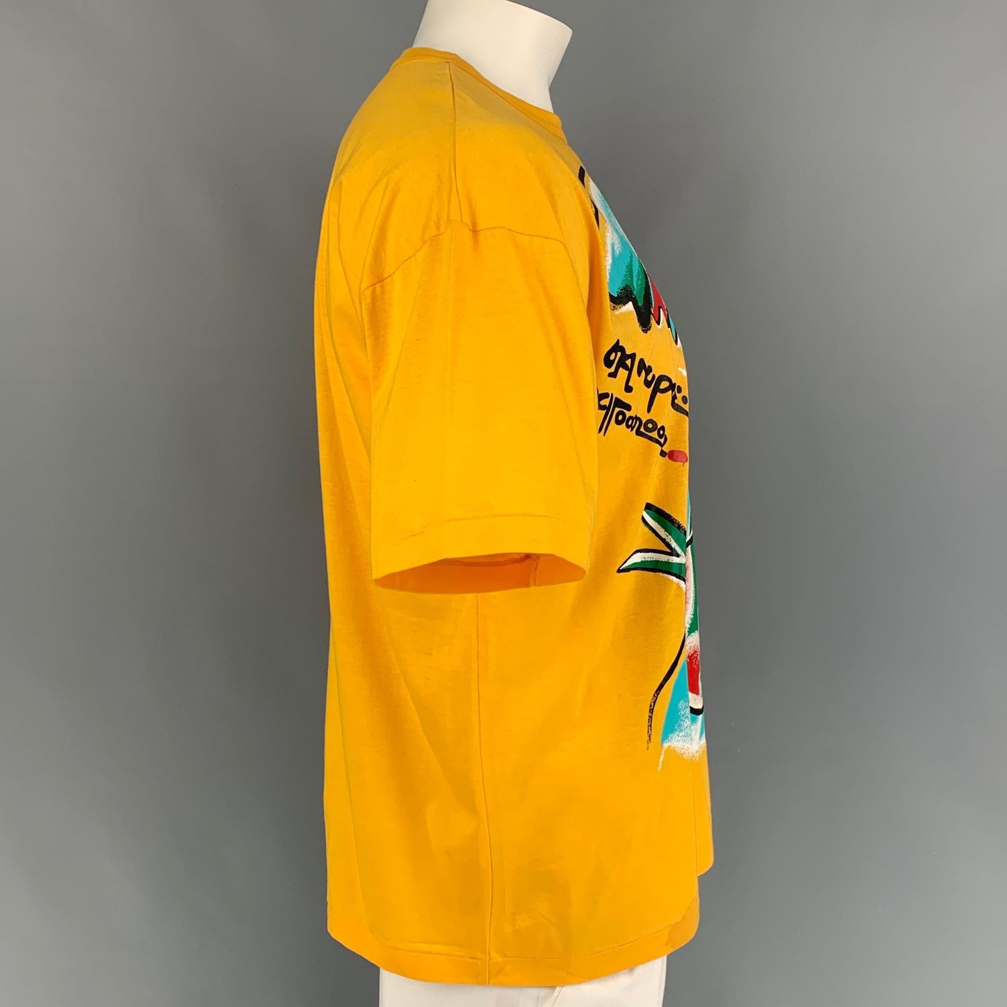 Vintage KANSAI YAMAMOTO t-shit comes in a yellow cotton with a graphic design featuring a crew-neck. Includes tags. Made in Japan.
Very Good
Pre-Owned Condition. Small mark at bottom.  

Marked:   L  

Measurements: 
 
Shoulder: 24 inches  Chest: 46