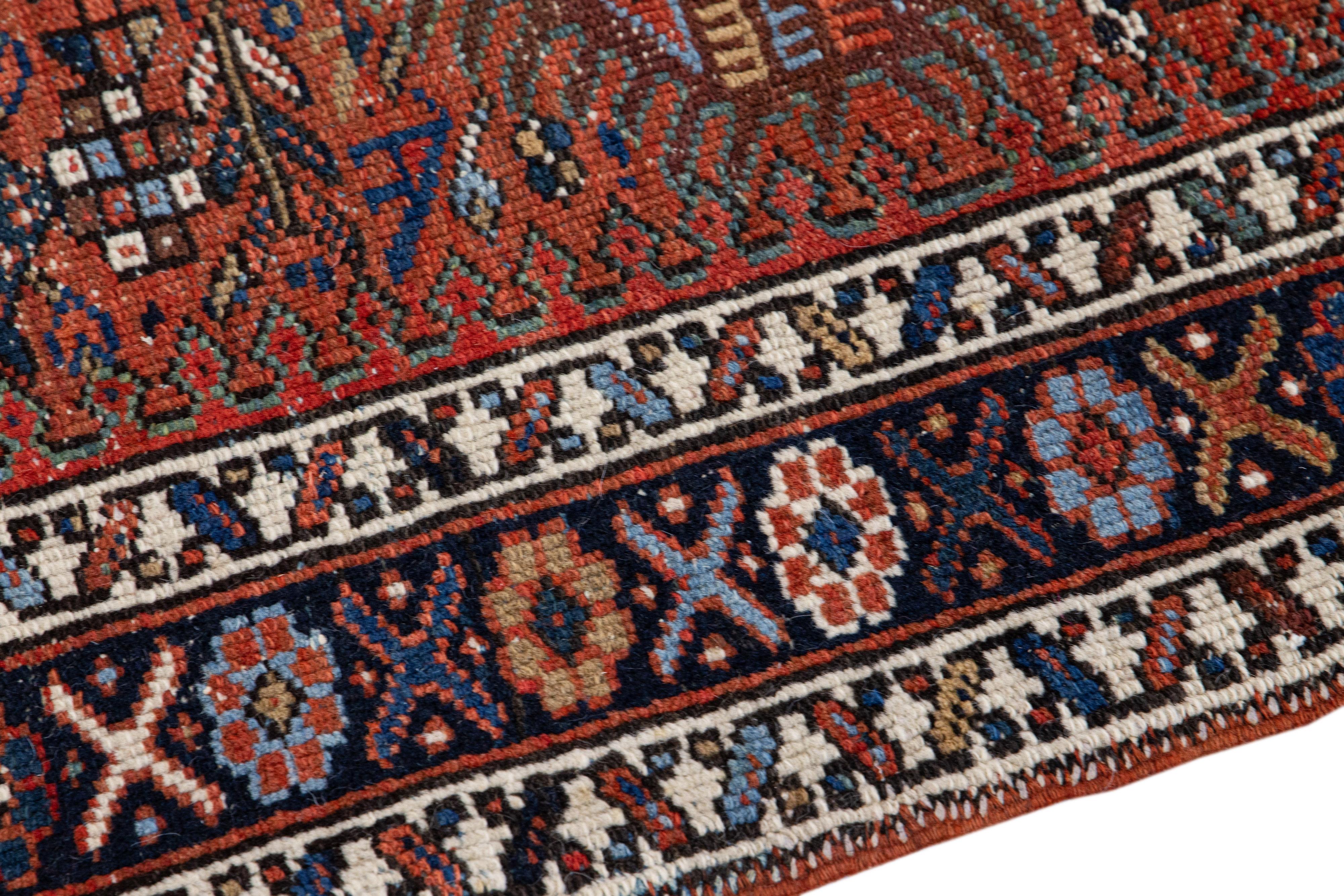 Beautiful vintage Karajah hand-knotted Wool rug with the red field. This Kalajah rug has multi-color accents in a gorgeous all-over geometric multi medallion design.

This rug measures: 3' x 10'8