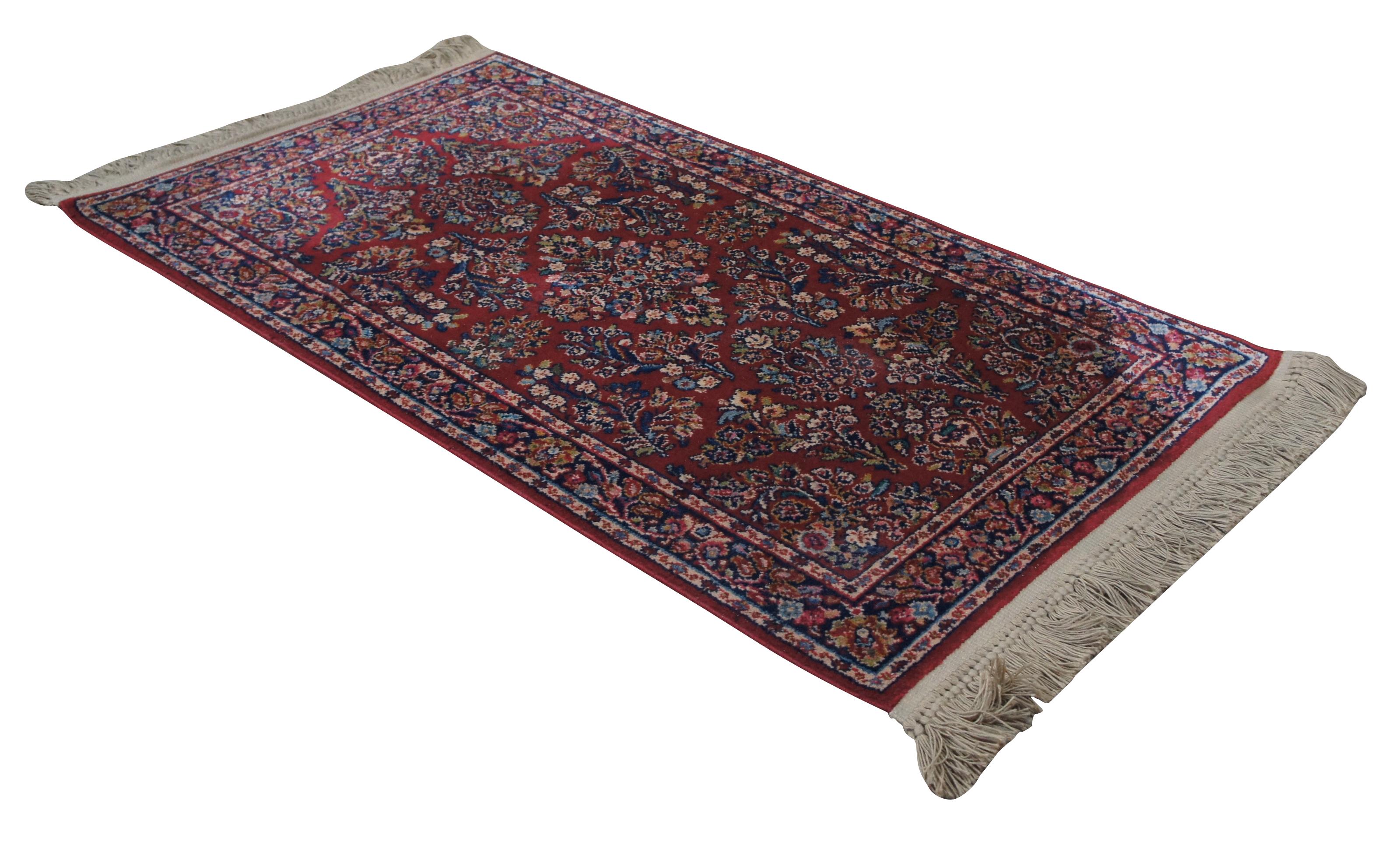 Karastan Design No. 785, Red Sarouk. Made of 100% Wool with a red background covered a floral design. Measures: 2.1 x 5'.