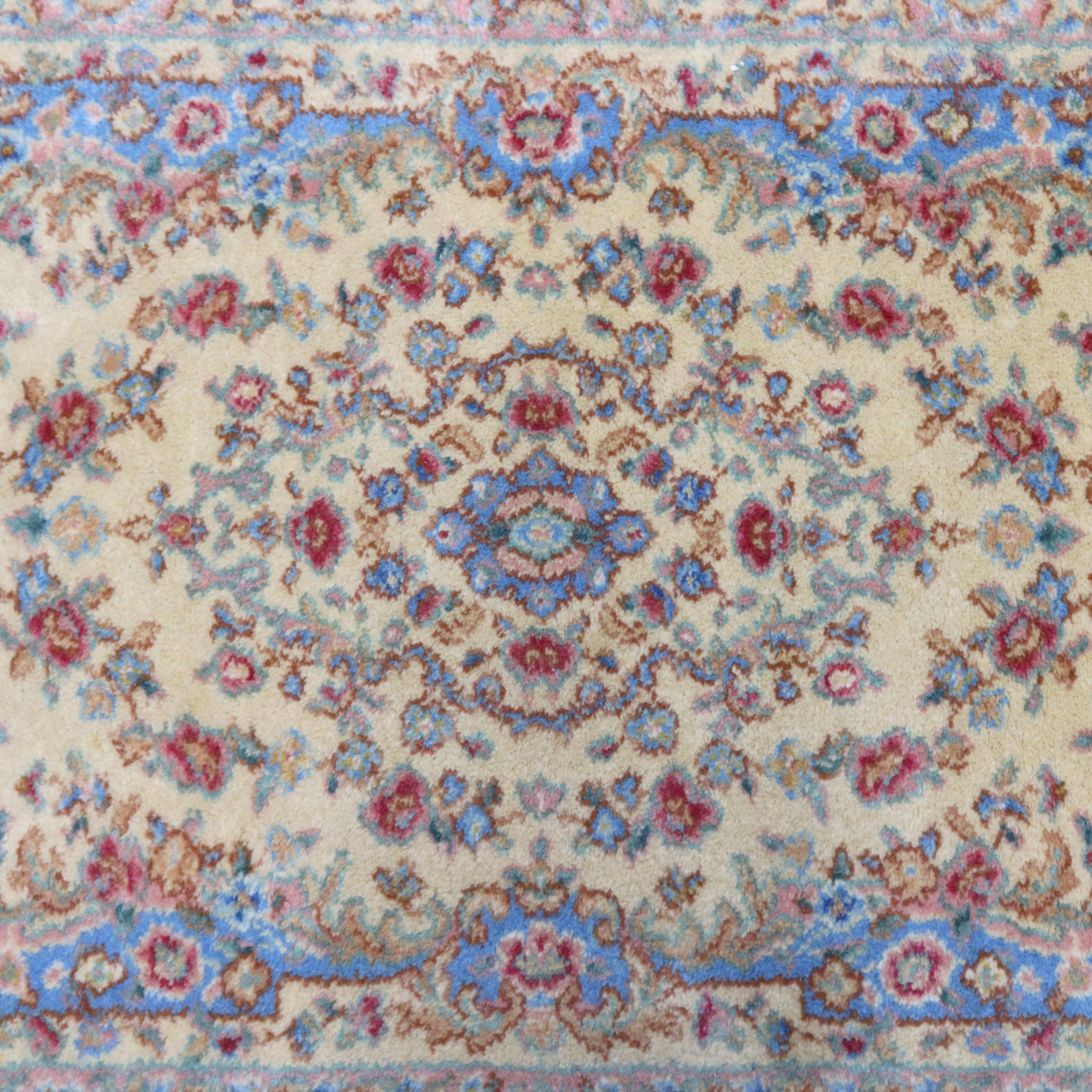 A vintage Karastan ivory medallion #711 Oriental rug offers blue, white and ink in pastel color palette with floral motif, circa 1950

Measures: 2.10' x 5'.