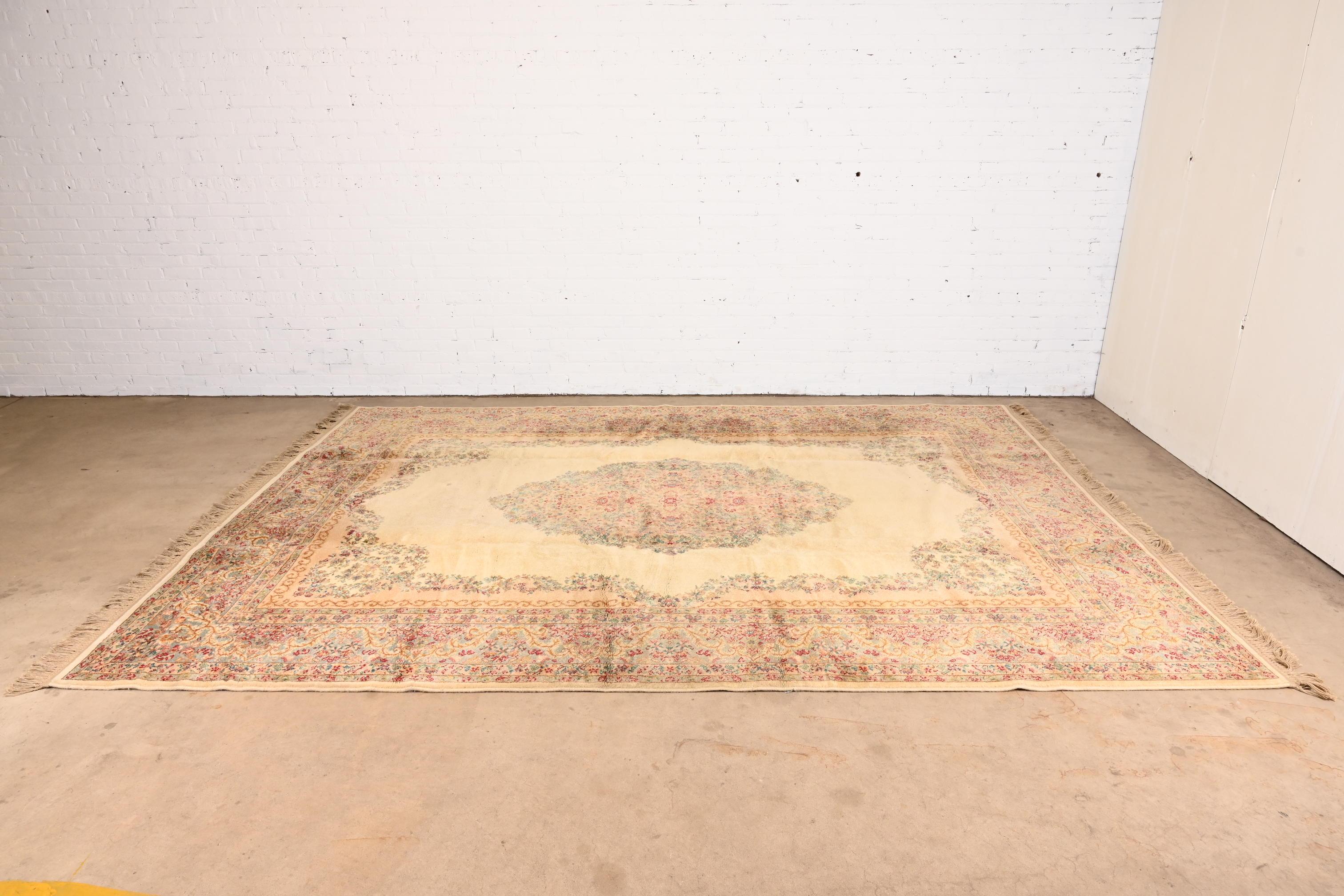 Vintage Karastan Kirman Room Size Wool Area Rug in Cream, Pink, and Light Blue In Good Condition In South Bend, IN
