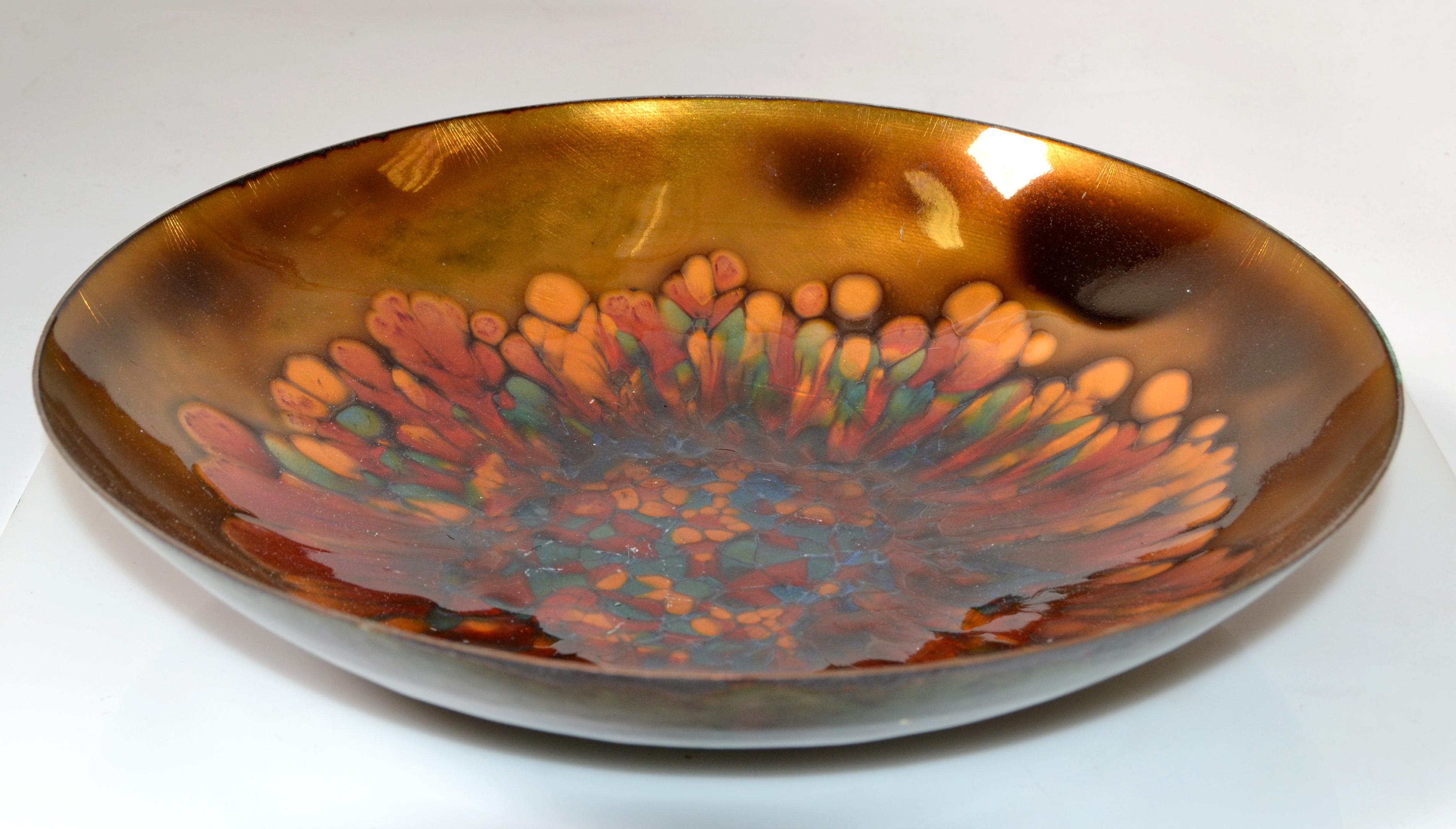 Vintage Kareka Enamel over Copper hammered decorative plate, centerpiece, bowl.
Beautifully crafted in hues of orange, brown and green colors.
Marked and Foil Label at the Base.