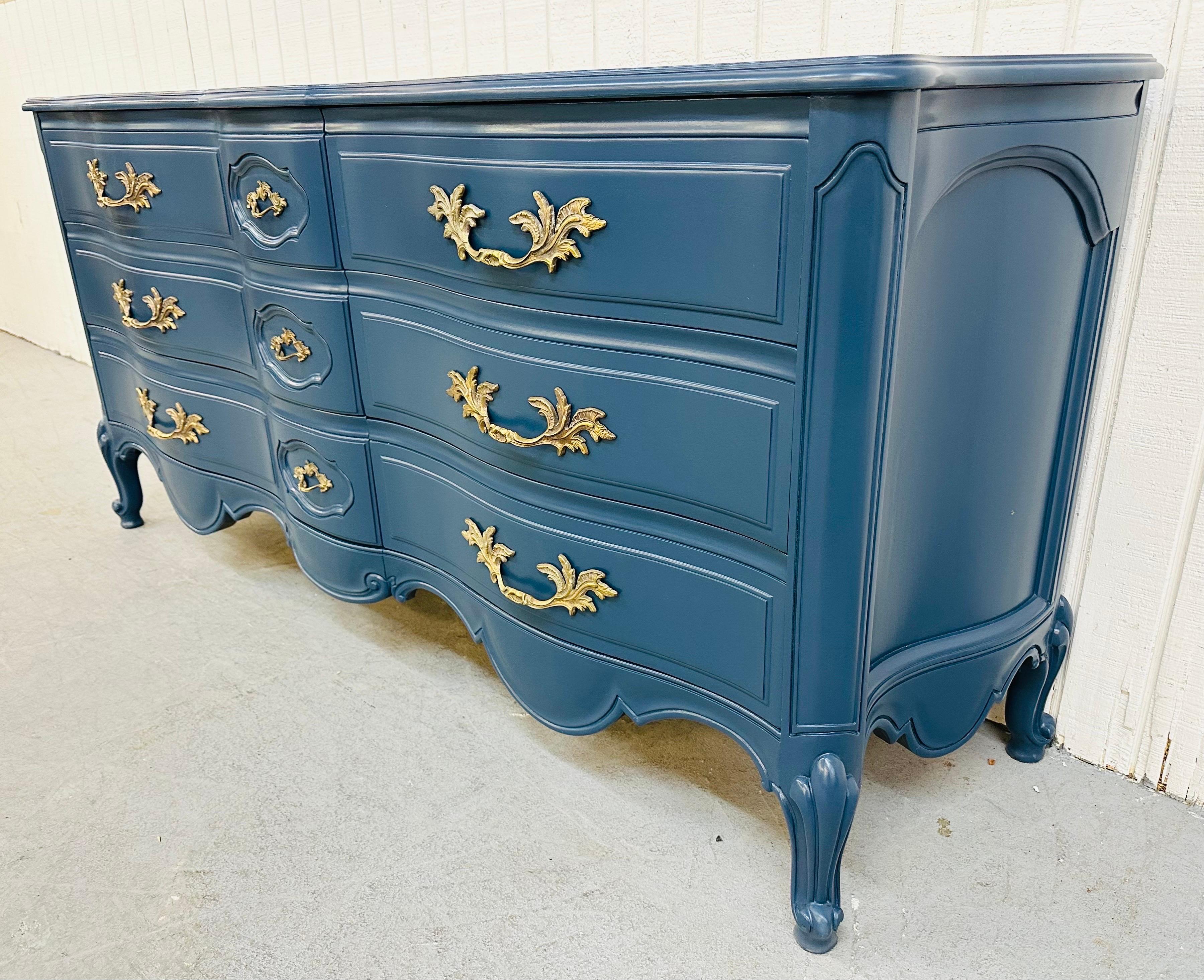 This listing is for a Vintage Karges Navy Blue French provincial dresser. Featuring exceptional quality from Karges Furniture, nine drawers for storage, original brass pulls, and a newly painted navy blue finish.