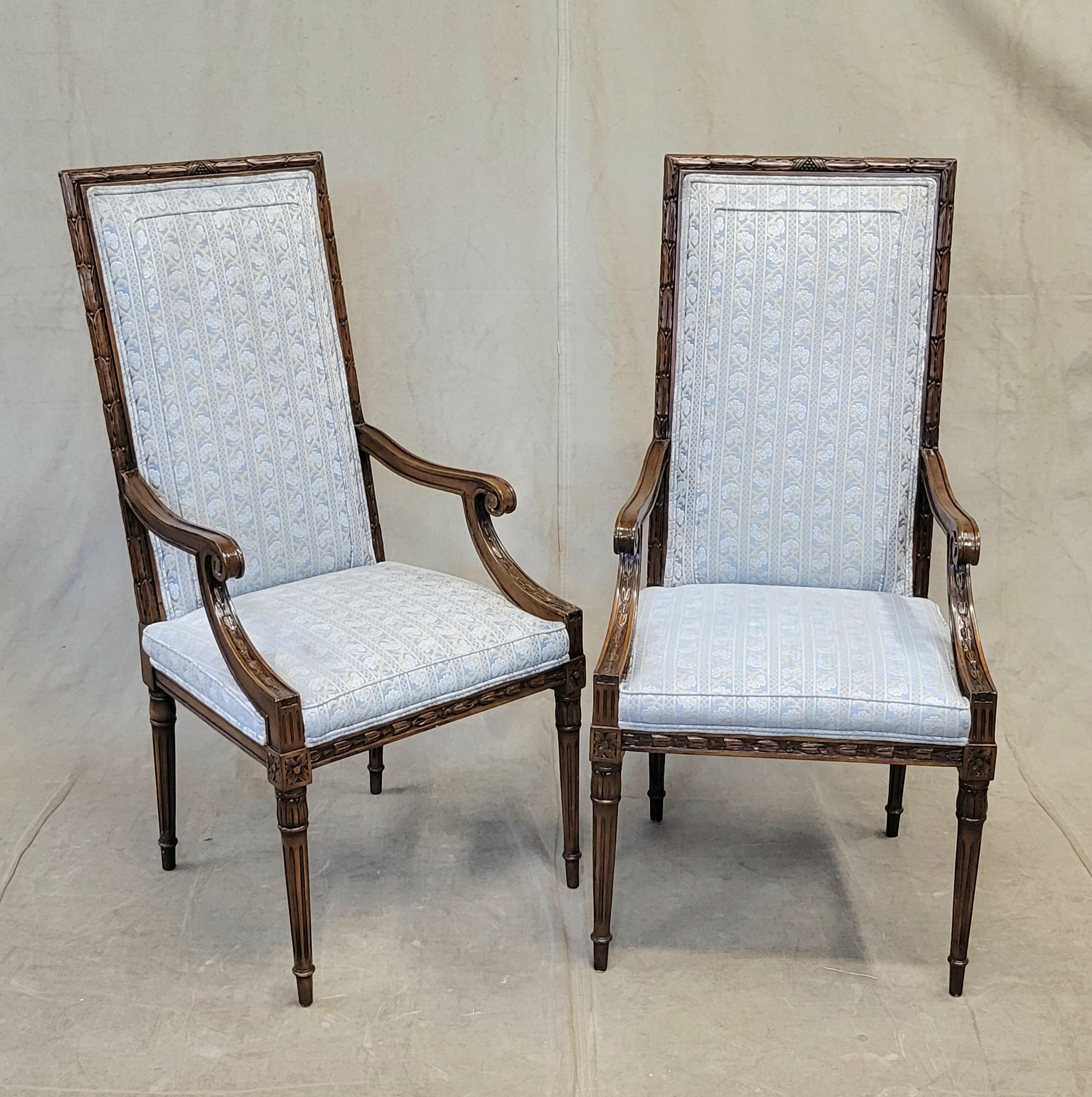 A truly elegant set of eight vintage (1960s or 1970s) beautifully crafted Karges richly carved dark walnut finish dining chairs with pale blue and cream colored striped upholstery. Hand carving on the chairs in acanthus leaves and bellflowers,
