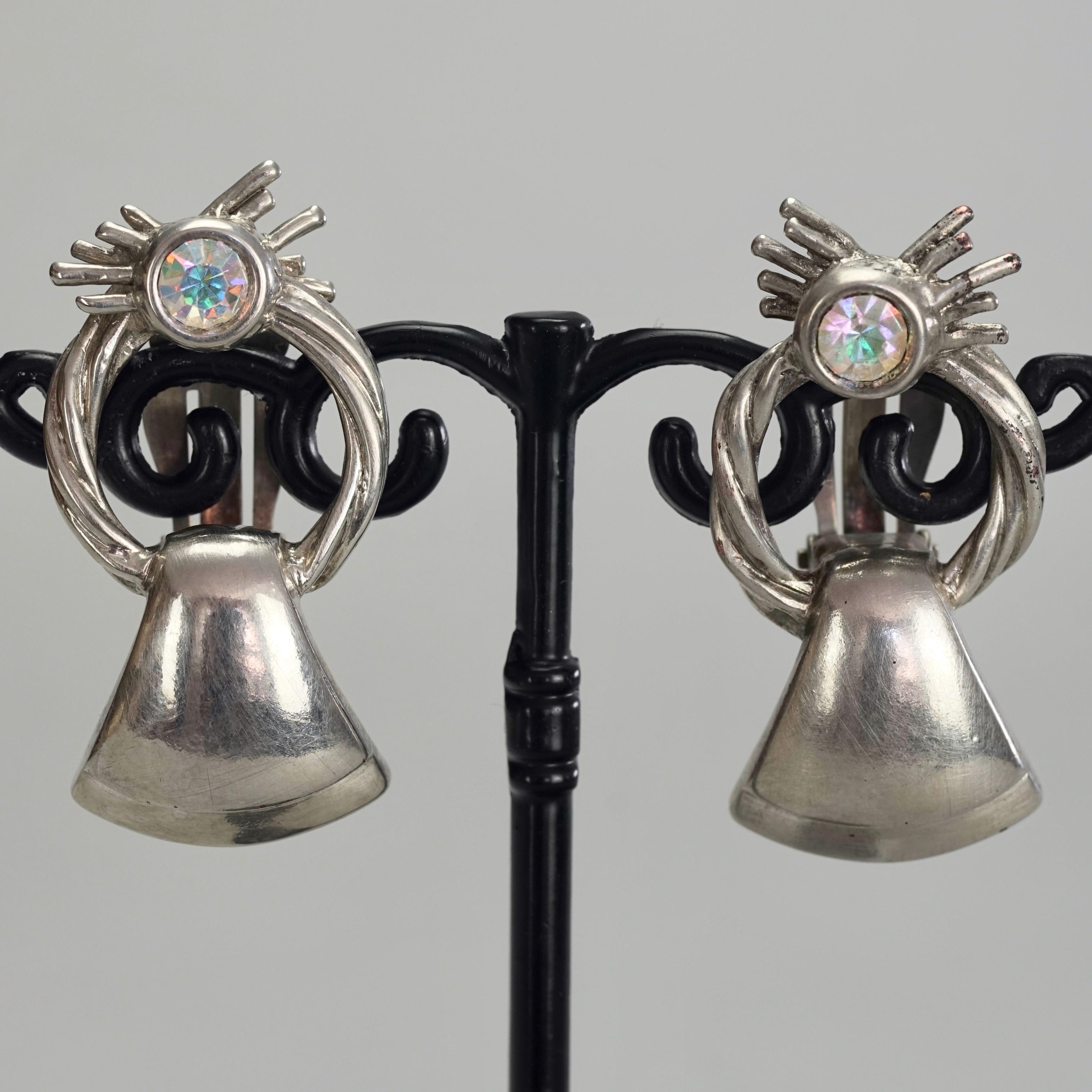 Vintage KARL LAGERFELD Door Knocker Silver Earrings

Measurements:
Height: 1.57 inches (4 cm)
Width: 0.78 inch (2 cm)
Weight per Earring: 14 grams

Features:
- 100% Authentic KARL LAGERFELD.
- Door knocker earrings with rhinestone embellishment.
-