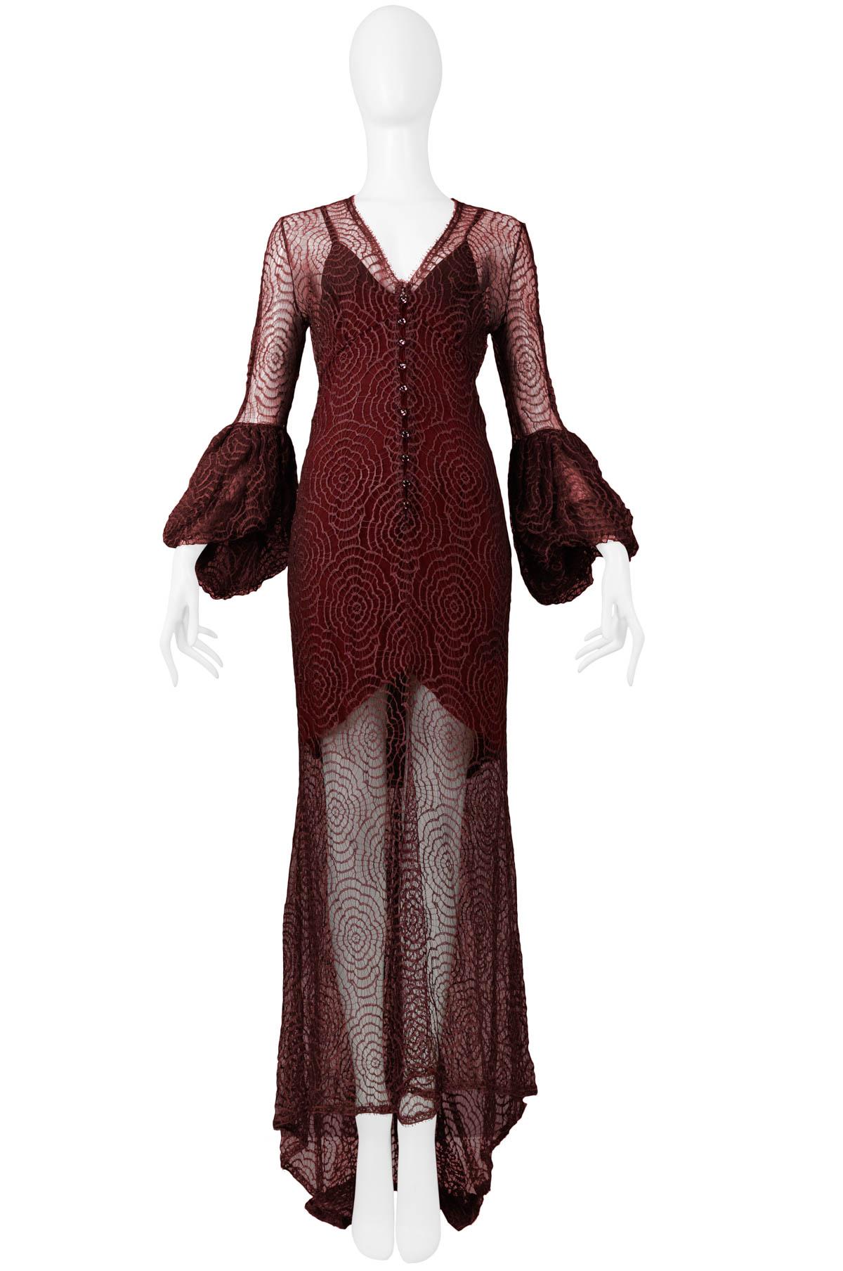Vintage Karl Lagerfeld for Chloé burgundy abstract floral lace gown featuring, flounce sleeves, button front detail, slip underlay and an asymmetrical hem. From the 1994 Collection.

Chole, Paris
Designed By Karl Lagerfeld
Size Small
Measurements: