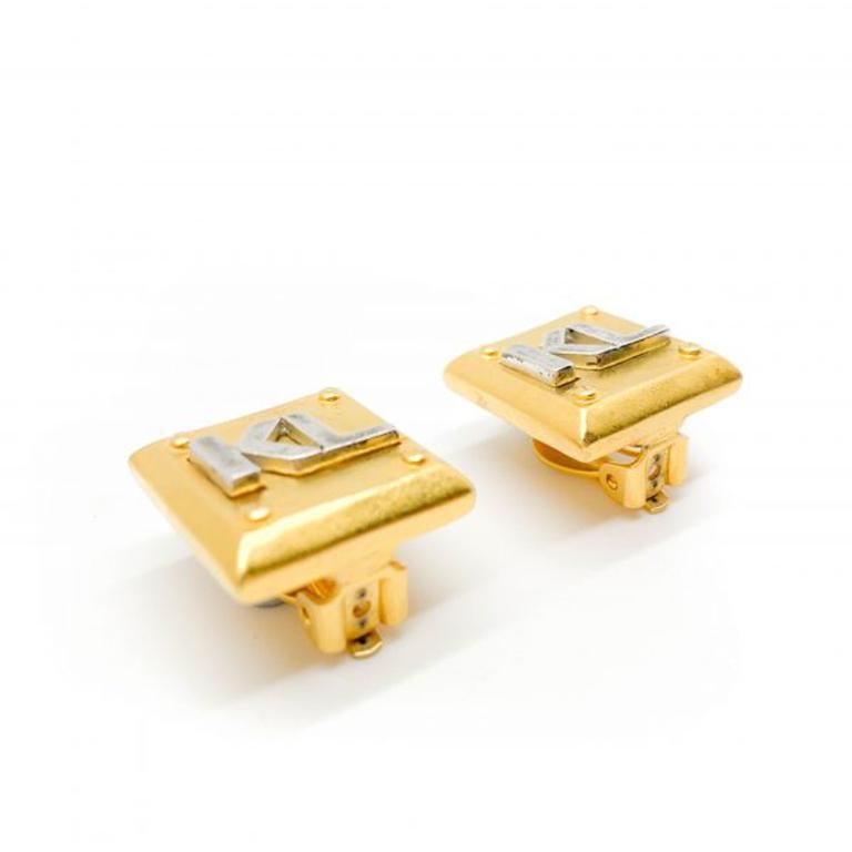 Vintage Karl Lagerfeld Earrings dating to the 1980s and during the first decade of the eponymous House Of Karl Lagerfeld. Incredible quality. Featuring contrasting brushed gold and silvertone metal and sporting the now iconic KL logo. Excellent