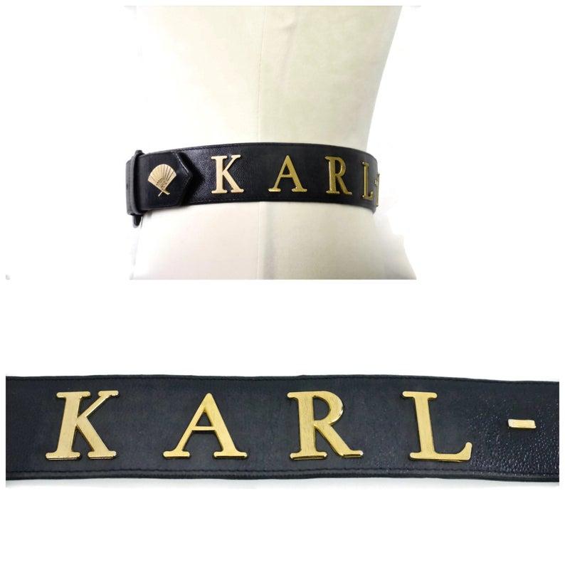 Vintage KARL LAGERFELD Letter Caviar Leather Belt

Measurements:
Buckle: 2 4/8 inches
Height: 1 6/8 inches
Overall Length: 36 inches
Will fit waists: 28 inches to 30 inches

Features:
- 100% Authentic KARL LAGERFELD.
- Navy Blue grained/ caviar