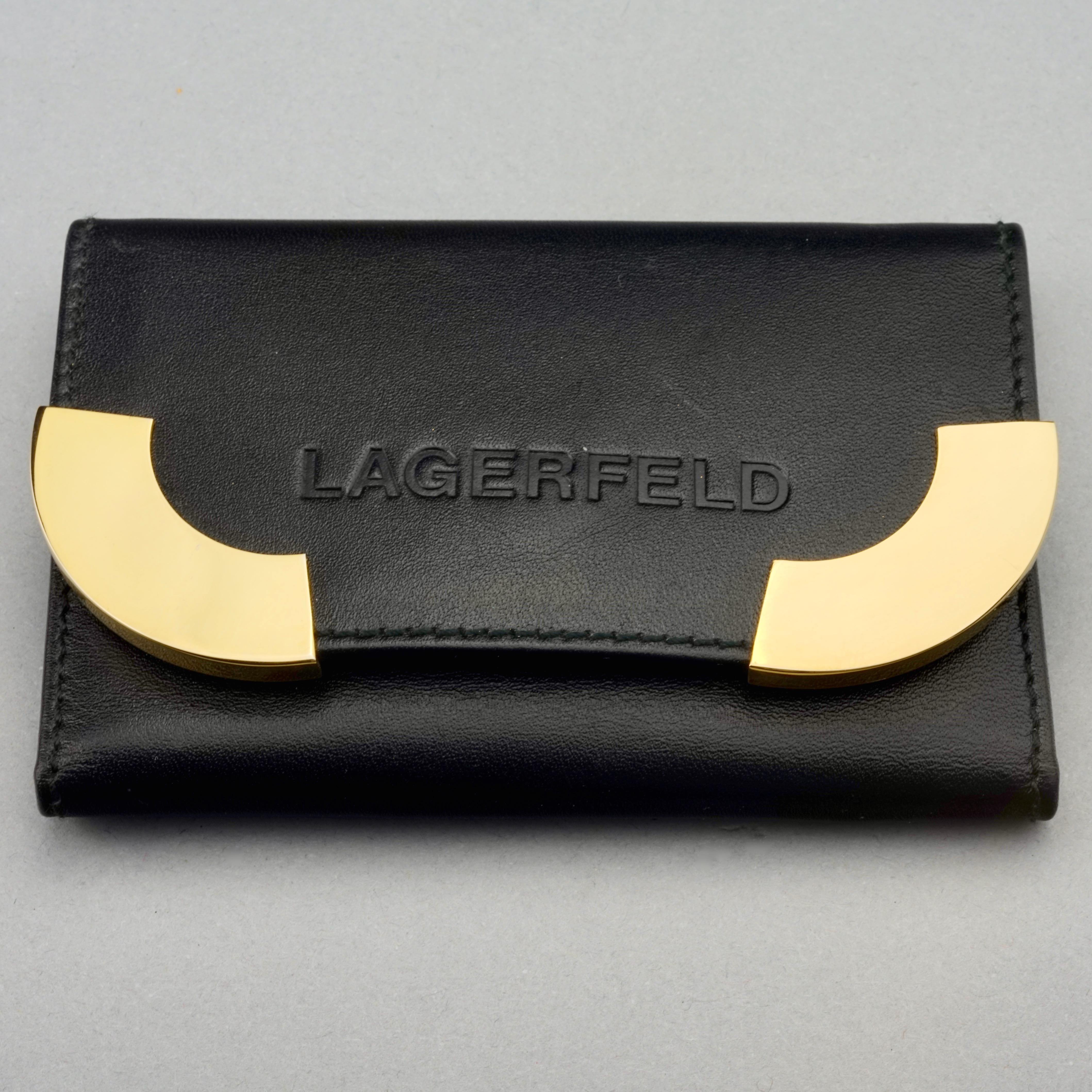 Vintage KARL LAGERFELD Logo Black Leather Key Holder Wallet

Measurements:
Height: 2.75 inches (7 cm)
Width: 4.13 inches (10.5 cm)

Features: 
- 100% Authentic KARL LAGERFELD.
- Black calf leather with spelled LAGERFELD and gold metal embellishment