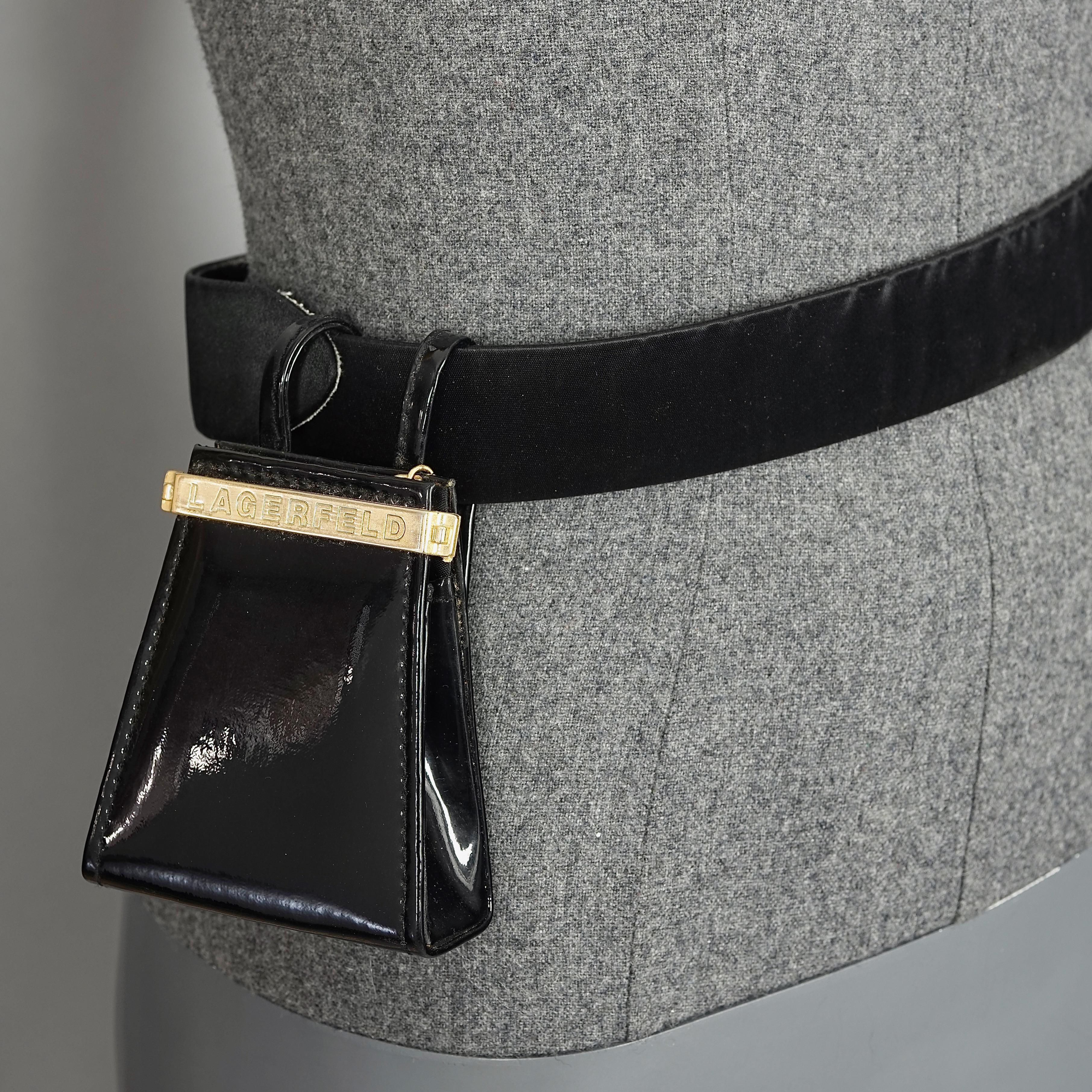 Vintage KARL LAGERFELD Logo Black Patent Coin Purse Mini Belt Bag

Measurements:
Height: 3.74 inches  (9.5 cm) excluding belt hoops
Width: 3.15 inches  (8 cm)
Depth: 1.38 inches  (3.5 cm)

Features: 
- 100% Authentic KARL LAGERFELD.
- Engraved