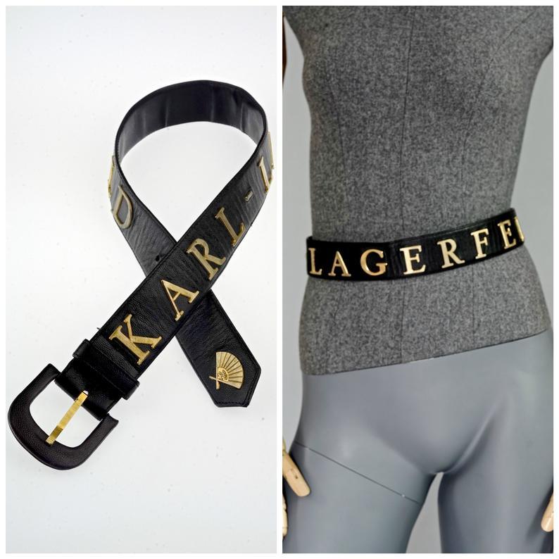 Vintage KARL LAGERFELD Logo Fan Spell Out Leather Belt

Measurements:
Buckle: 2.36 inches (6 cm)
Height: 1.57 inches (4 cm)
Will fit waists: 26.37 inches, 27.36 inches and 28.54 inches (67 cm, 69.5 cm and 72.5 cm)

Features:
- 100% Authentic KARL
