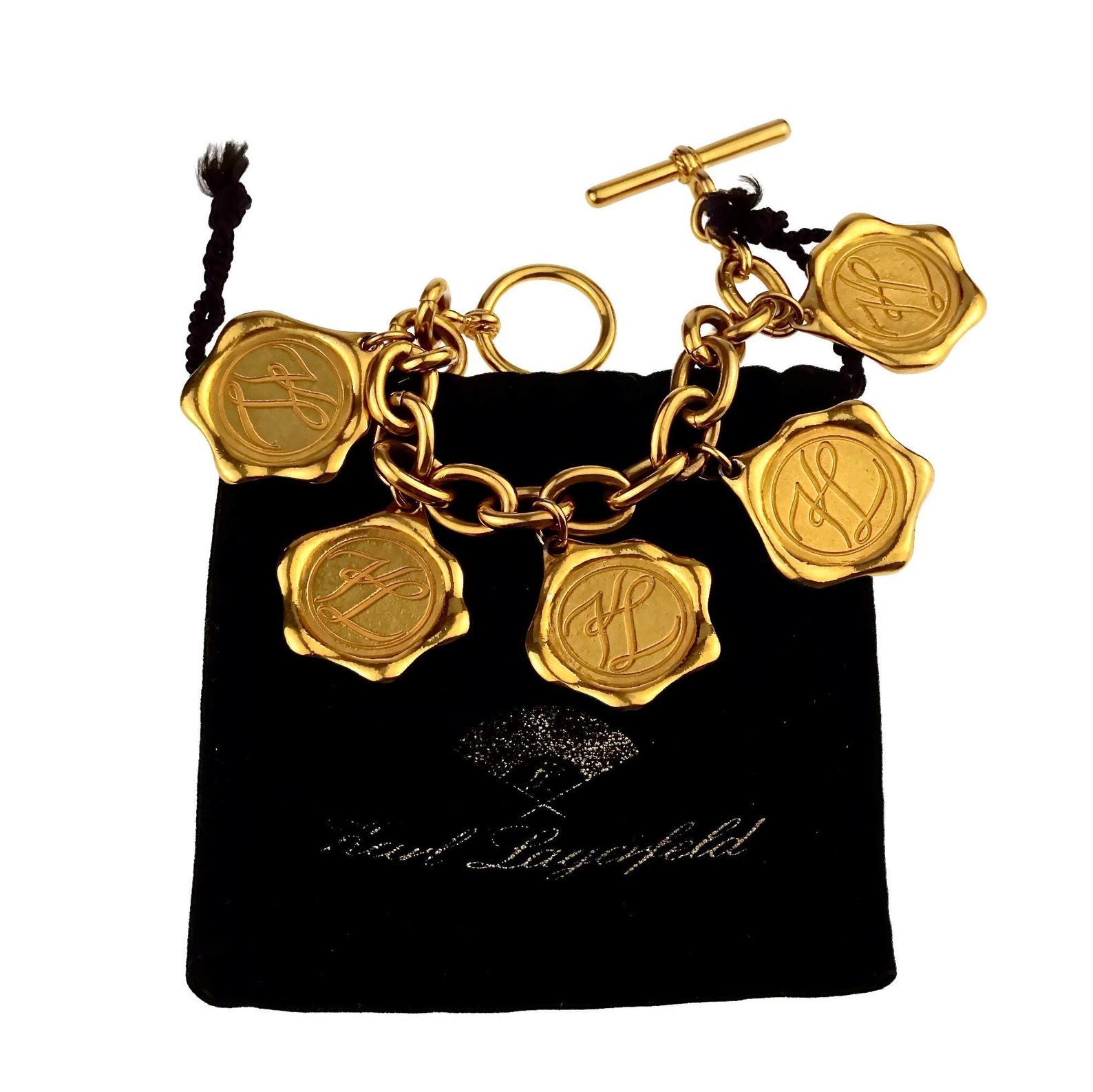 Vintage KARL LAGERFELD Logo Wax Seal Coin Medallion Charm Bracelet

Measurements:
Height: 2.16 inches (5.5 cm)
WearableLength: 8.26 inches (21 cm)

Features: 
- 100% Authentic KARL LAGERFELD.
- Wax seal motif.
- Embossed KARL LAGERFELD at the front