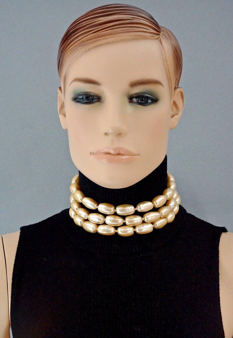 Vintage KARL LAGERFELD Multi Layer Oval Pearl Necklace

Measurements:
Height: 1.96 inches  (5 cm)
Pearls: 0.47 inch X 0.86 inch (1.2 cm X 2.2 cm)
Wearable Length: 12.59 inches to 14.56 inches (32 cm to 37 cm)

Features:
- 100% Authentic KARL