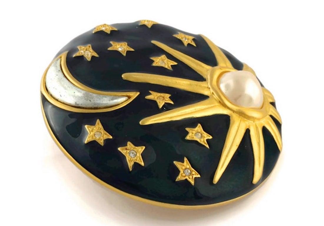 Vintage KARL LAGERFELD Sun Moon Stars Enamel Brooch

Measurements:
Height: 2 2/8 inches
Width: 2 2/8 inches

Features:
- 100% Authentic KARL LAGERFELD.
- Massive dark/ navy blue enamel brooch.
- Sun with faux pearl, moon in silver tone and stars