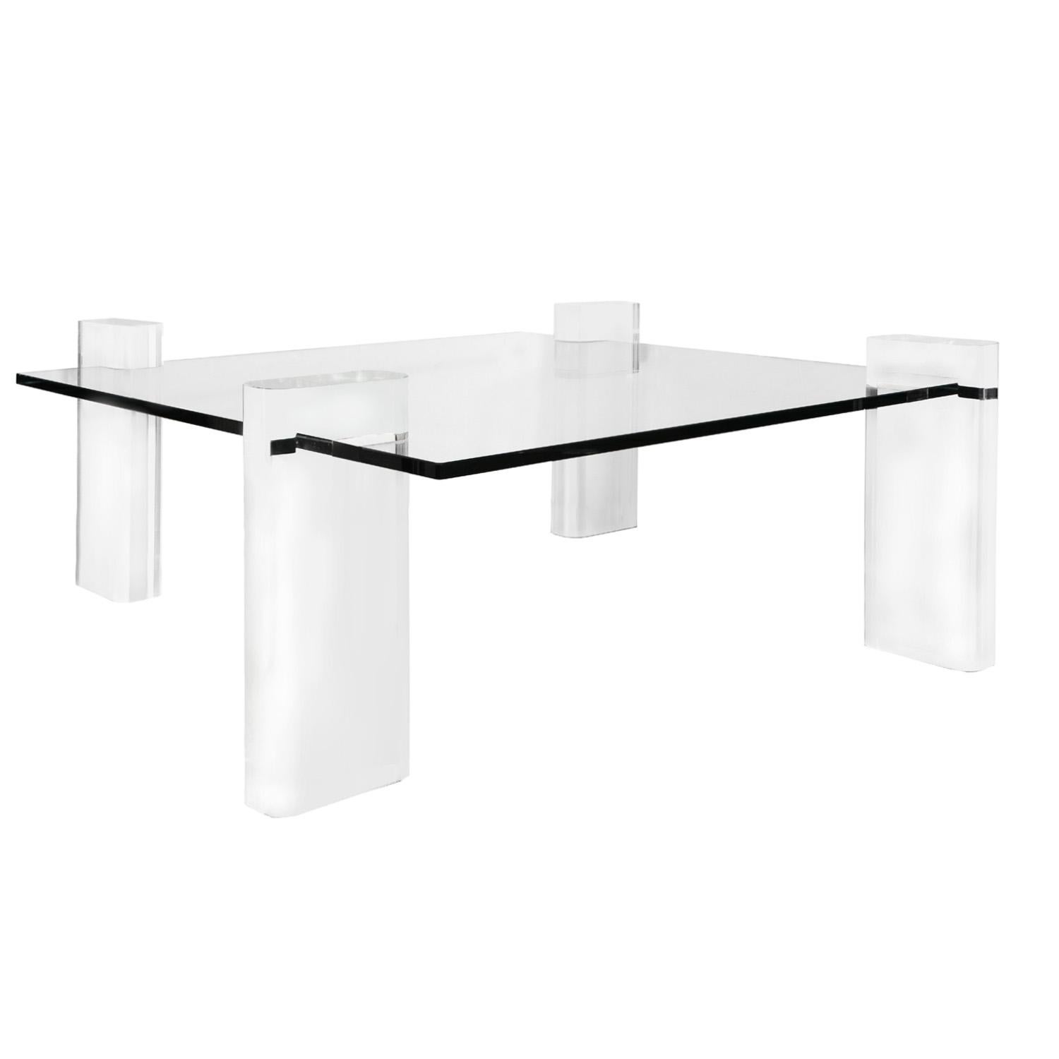 Clear solid Lucite leg coffee table with thick glass top by Karl Springer, American 1980's
The legs of this iconic table can be reconfigured to accommodate a round or square top of varying dimensions.

Dimensions as shown:
Width: 54 inches
Depth:v54