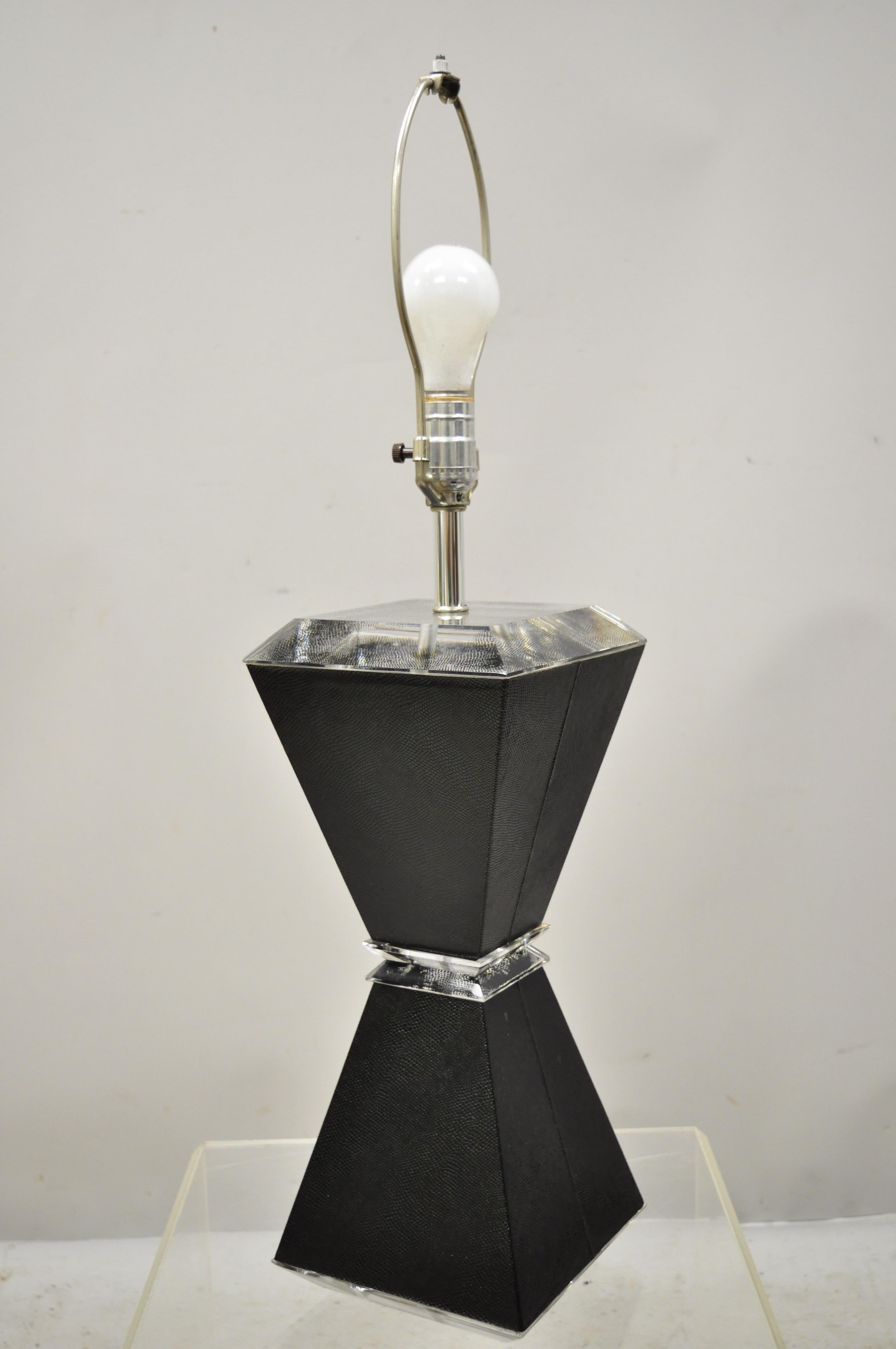 Vintage Karl Springer style Lucite Hourglass black faux sharkskin table lamp. Item features textured black faux sharkskin hourglass body, Lucite accents, clean modernist lines, quality craftsmanship, great style and form. Measurements: 31