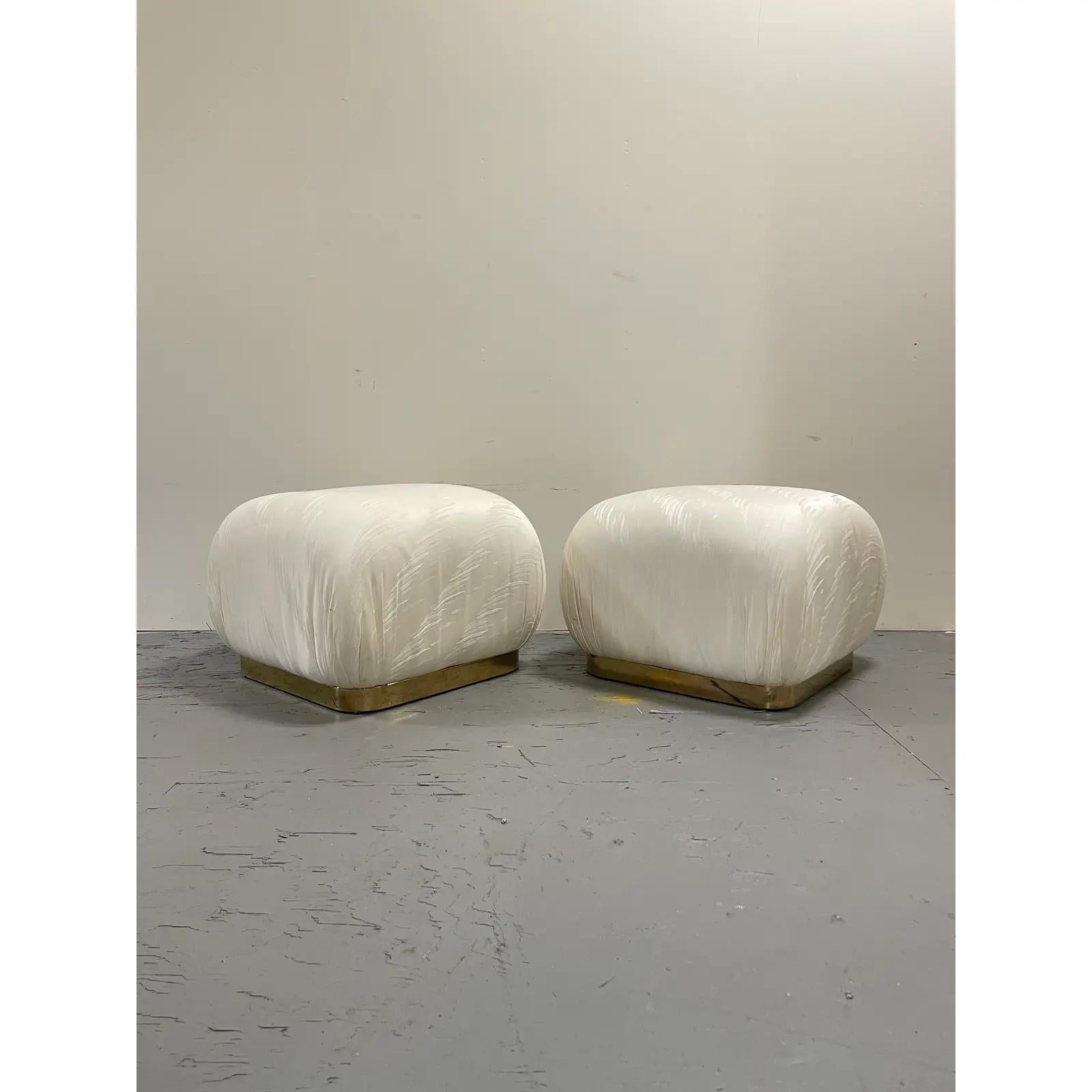 Vintage pair of brass base souffle ottomans in the manner of Karl Springer. Timeless design offers versatile use as ottoman or additional seating.
Curbside to NYC/Philly $350