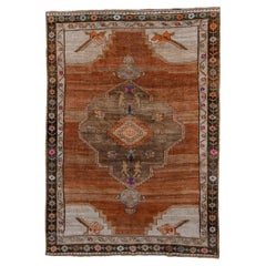 Alfombra vintage Kars con campo abierto y borde floral