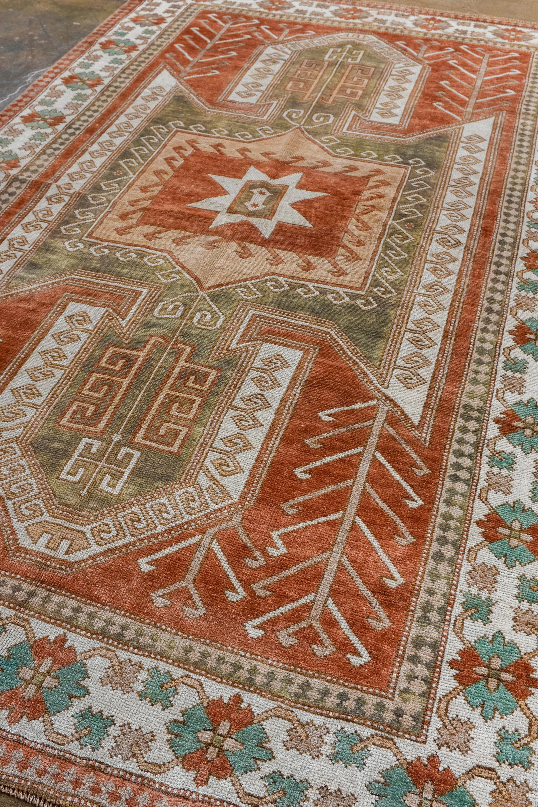 Turkish Vintage Kars Rug with Red Field and A Bold Medallion  For Sale