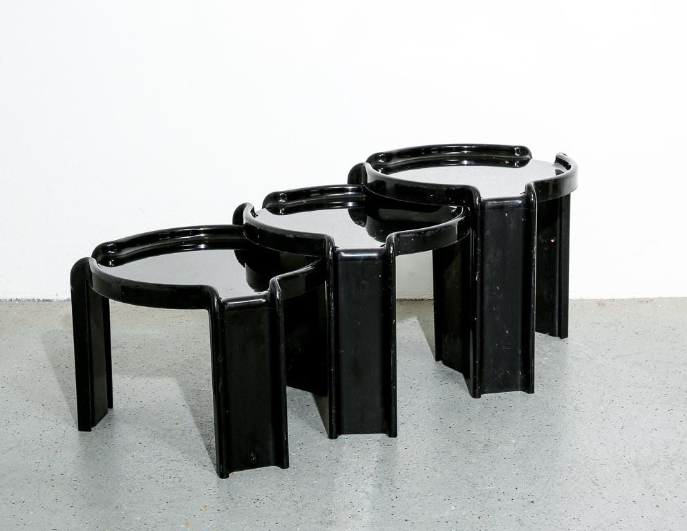 Vintage nesting tables designed by Giotto Stoppino for Kartell, Italy. Three tables in total manufactured in molded black plastic.