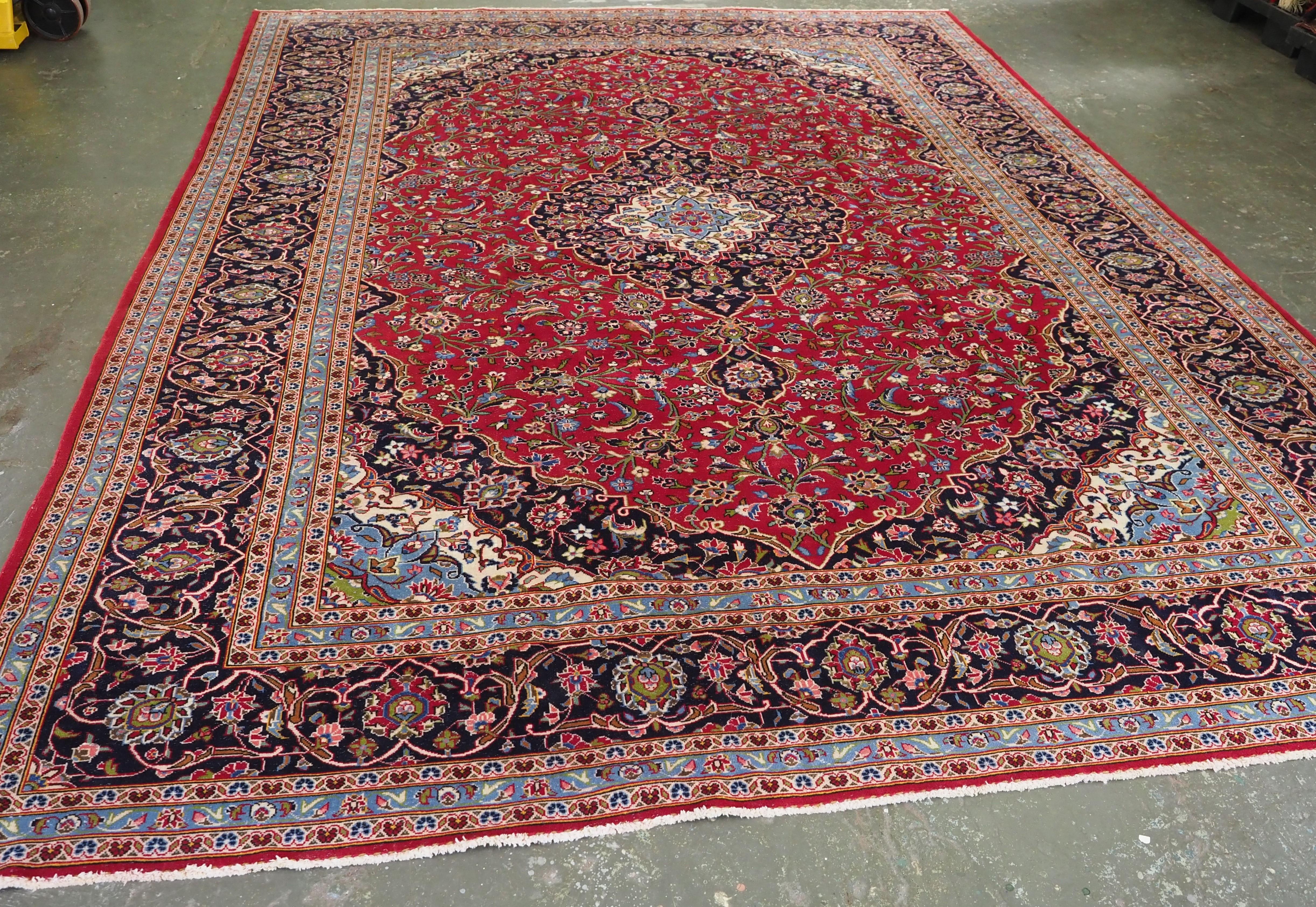 
Size: 13ft 0in x 9ft 8in (395 x 294cm).

Vintage Kashan carpet of classic design and good colour.

Circa 1950.

The carpet has a small central medallion which is surrounded by a field of floral designs on a rich red ground.

The border is of a